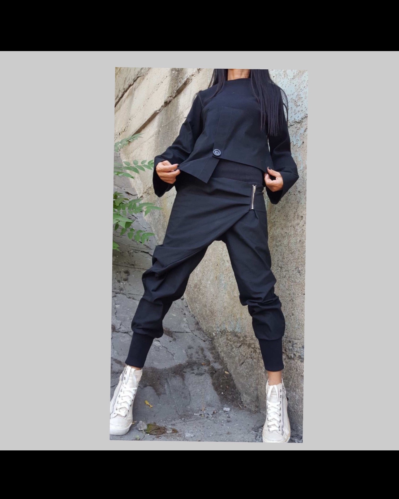 Step into effortless edge with this asymmetric black cotton two-piece set, featuring relaxed harem pants and a flowy statement top 🖤 Made for comfort and movement, this minimalist yet bold outfit flatters all body types and is available in plus sizes. Whether you’re running errands or embracing your inner creative, this everyday set blends function with fashion-forward design.