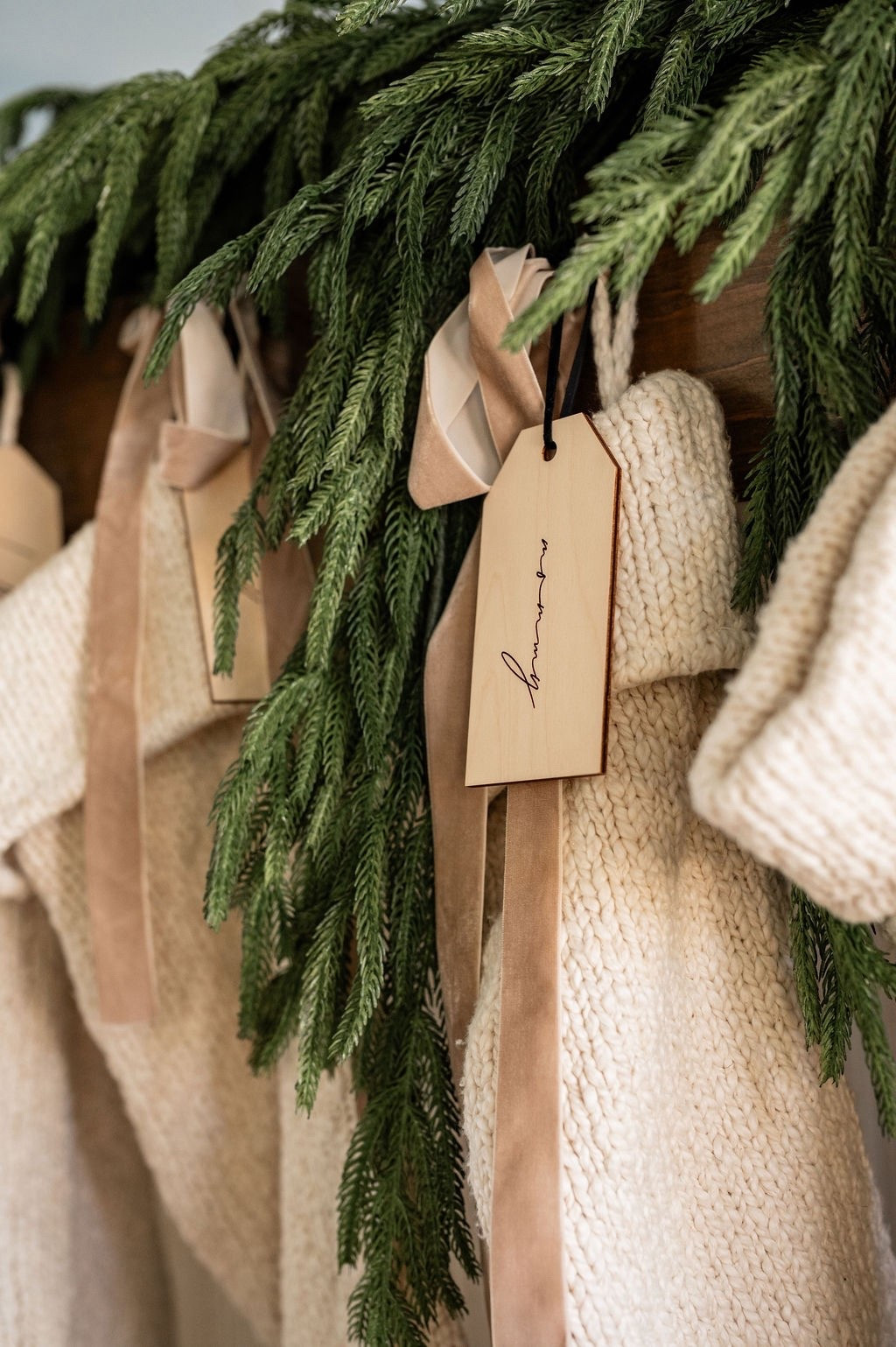 The sweetest stocking details 🤍🎄 Loving these neutral knit stockings, personalized wooden tags from Etsy, Amazon velvet ribbon, and lush faux cedar garland. Perfect inspo for neutral Christmas decor, modern classic holiday styling, Christmas stocking ideas, mantel decorating inspiration, and LTK holiday home finds. 🌲✨

#LTKHome #LTKHoliday #LTKSeasonal