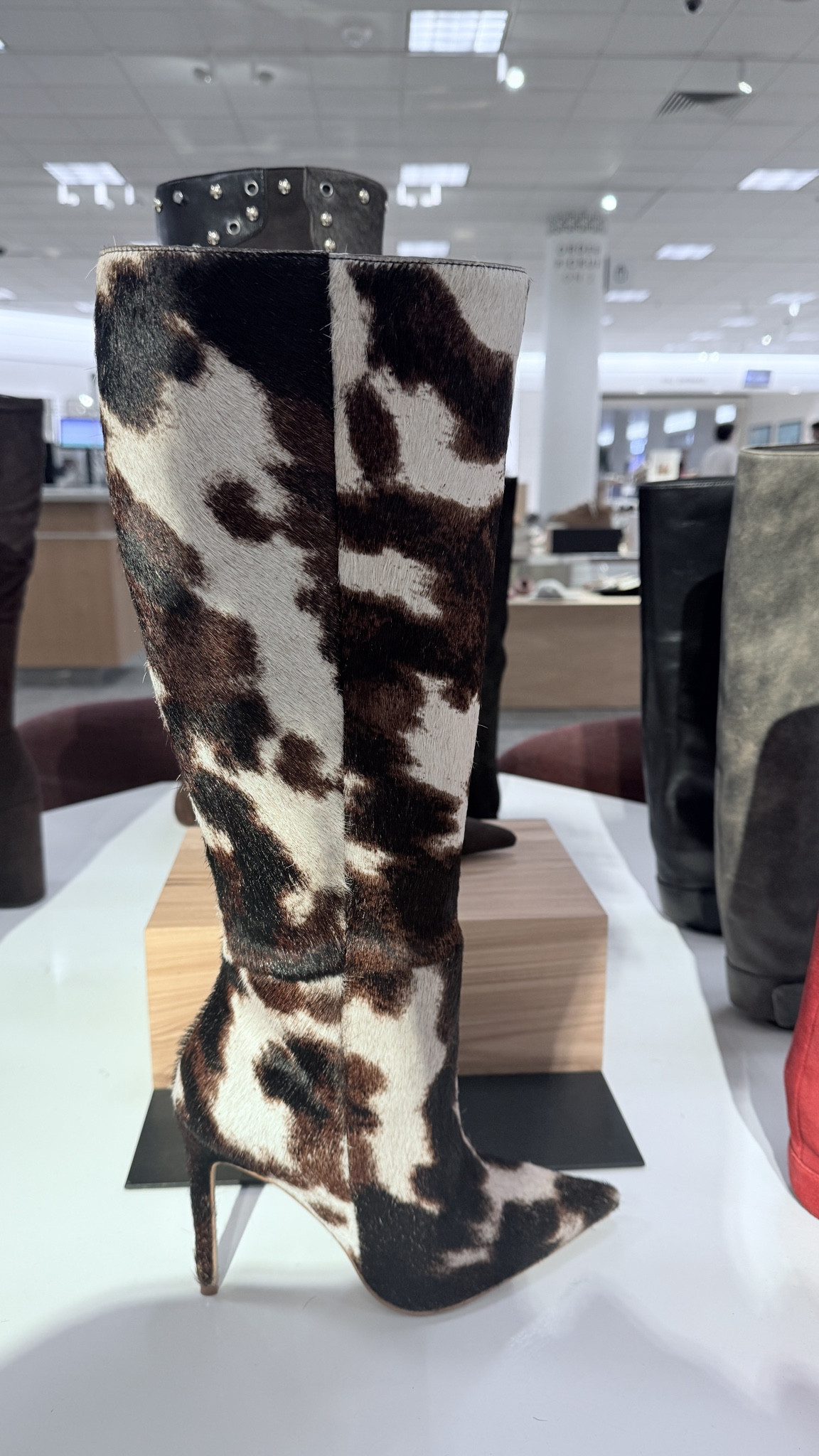 cow print knee high heeled boot 

#LTKSeasonal #LTKShoeCrush