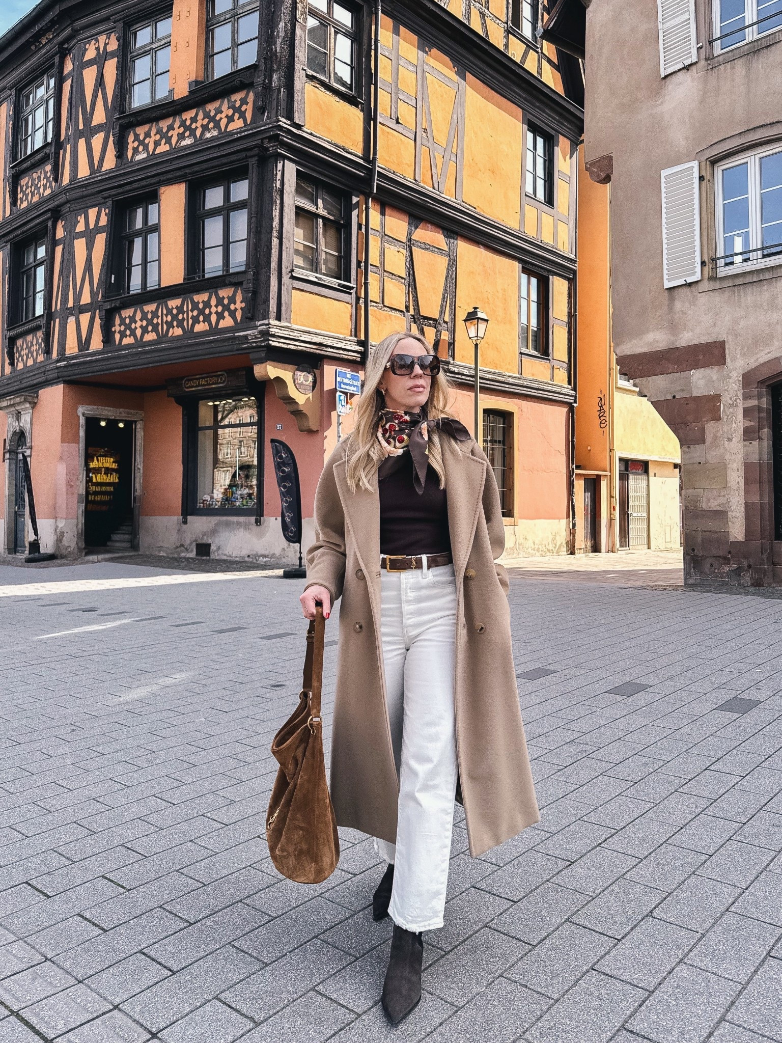 Spring outfit, European vacation look, camel coat, silk scarf outfit, @Levi's white jeans, white jeans with boots for spring 

#LTKTravel #LTKOver40 #LTKSeasonal