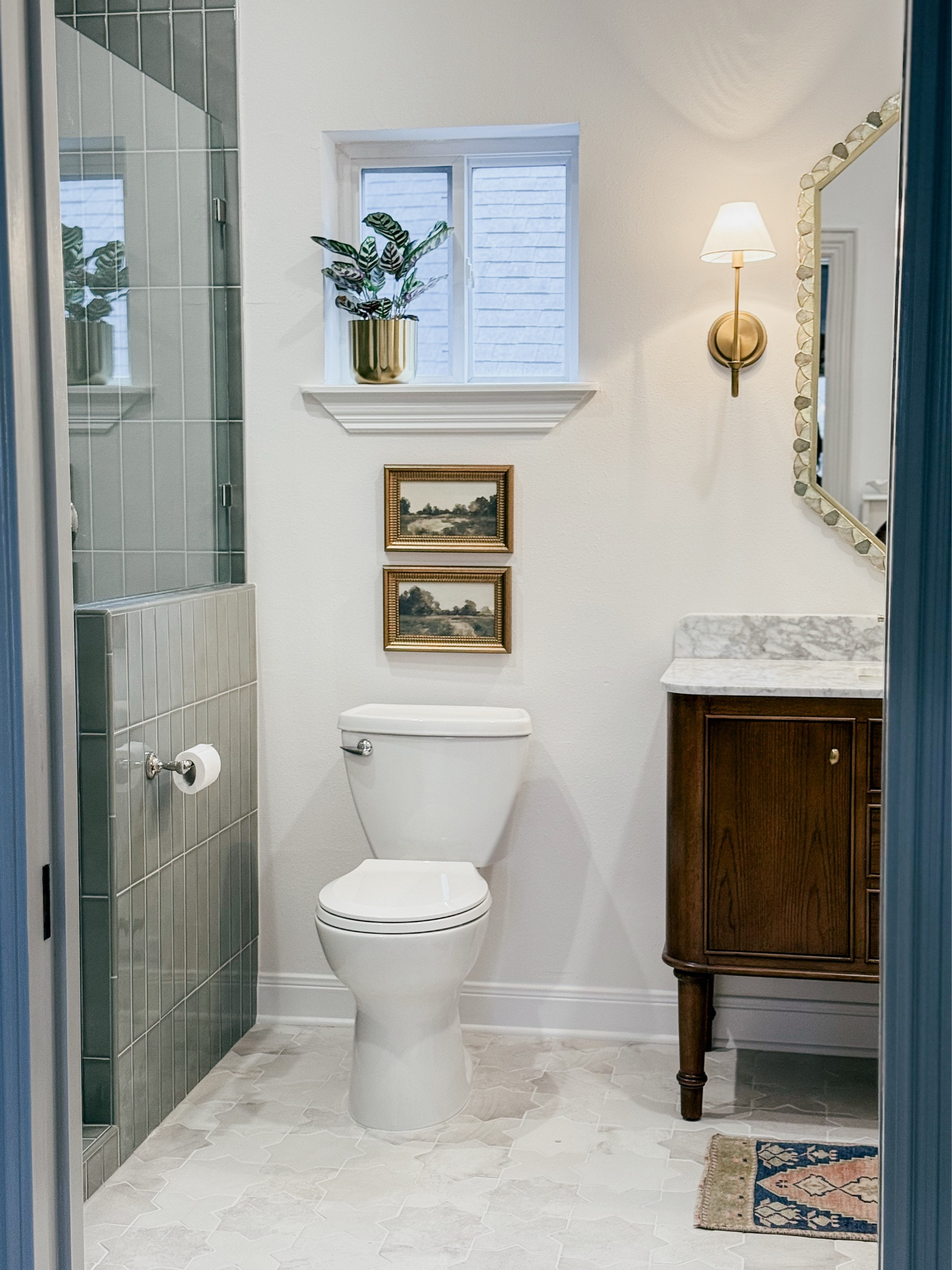 Our upstairs bathroom is a huge transformation! Love how it turned out! Shower tile from floor and decor. Bathroom floor tile from local store. 

THEBLOOMINGNEST bathroom guest bath flooring tile vanity sconce art mirror Anthropologie target wayfair 