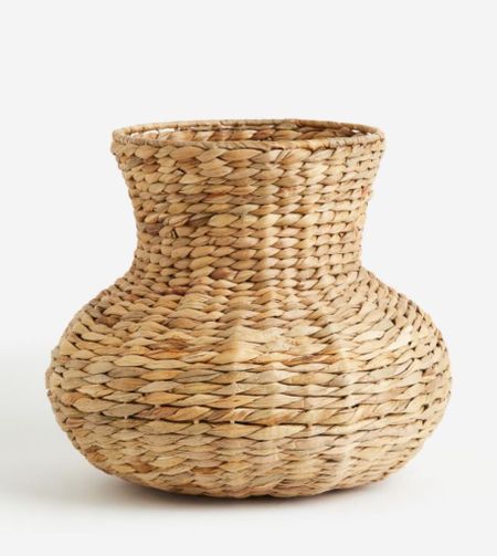 Rattan is a great way to add texture to summer decor. Imagine a bunch of hydrangeas in this vase!

#LTKfindsunder50 #LTKitbag #LTKhome