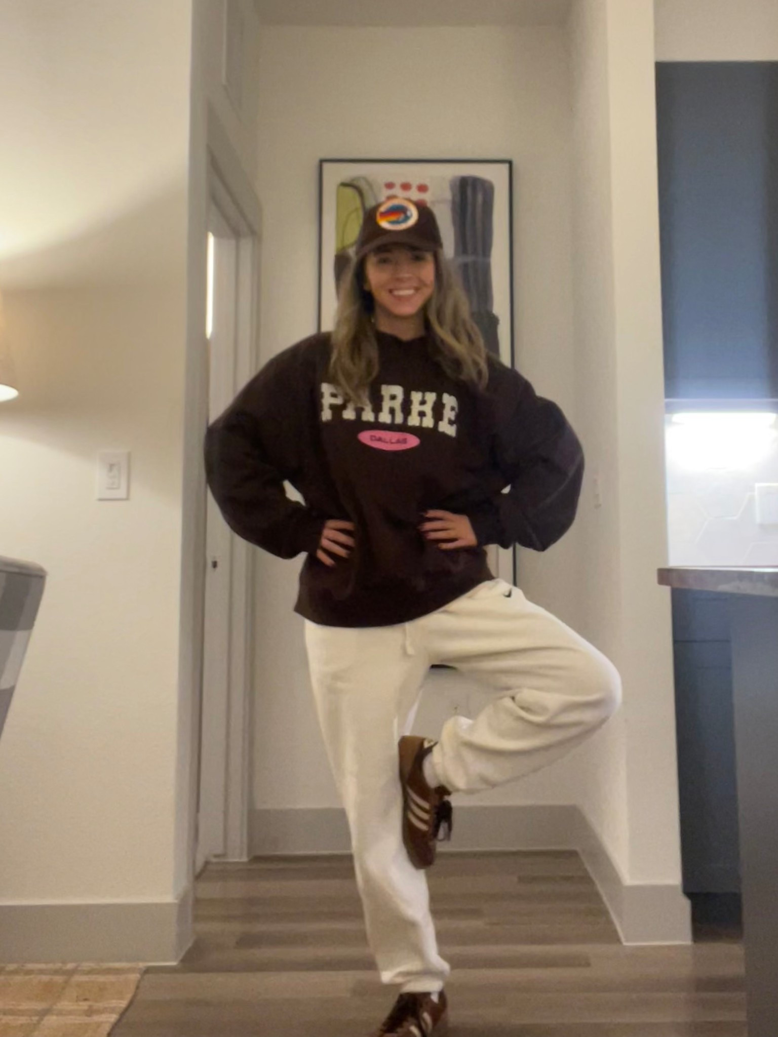 VERY casual travel outfit home after the holidays! Aviator nation brown hat, brown parke Dallas sweatshirt, white Nike sweat pants, and brown Adidas sambas :)

#LTKTravel #LTKHoliday #LTKootd