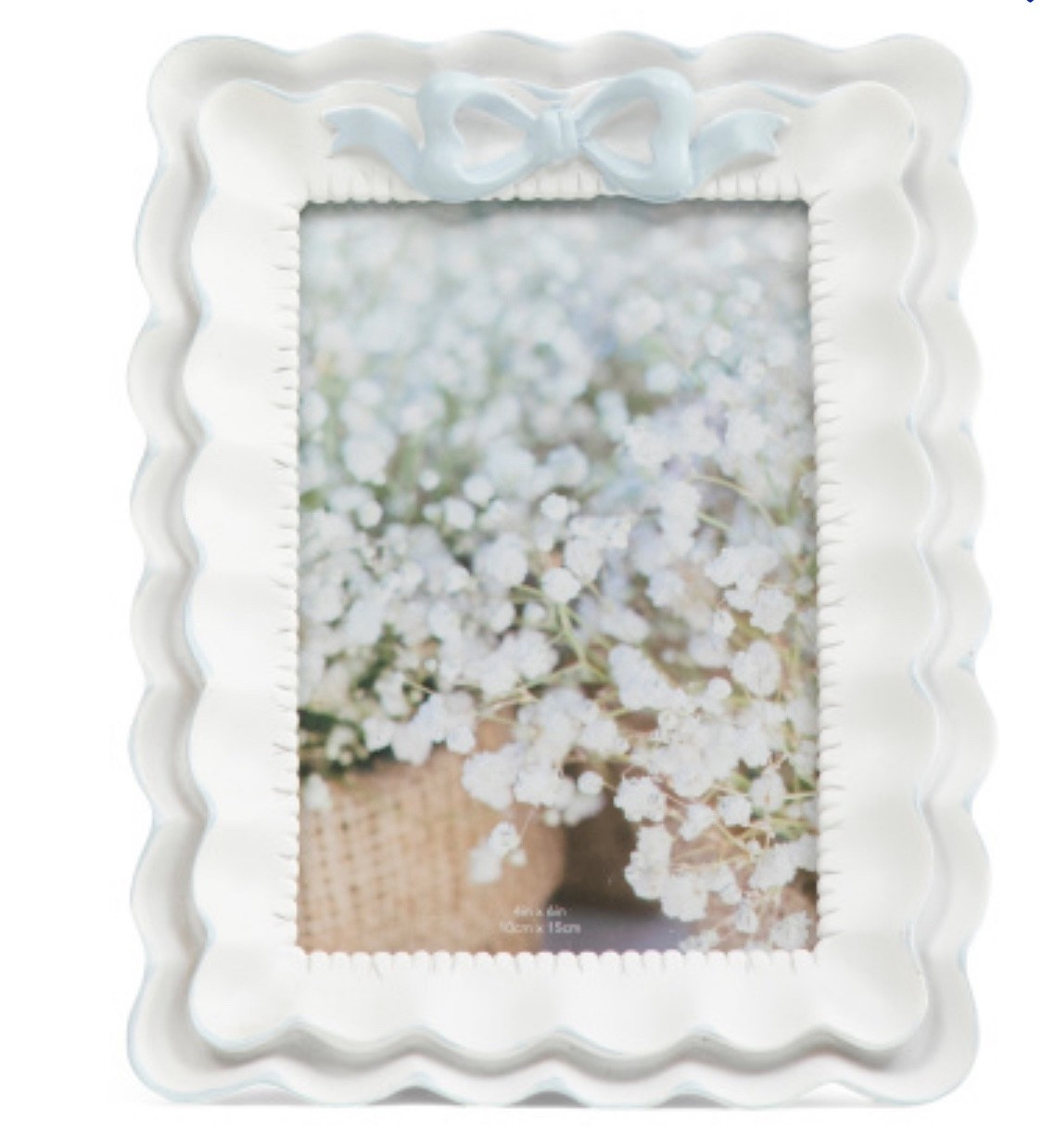 The prettiest LSF inspired picture frame! I love how dainty the bow detail is with the ruffle border so cute!!

#LTKHome #LTKSeasonal