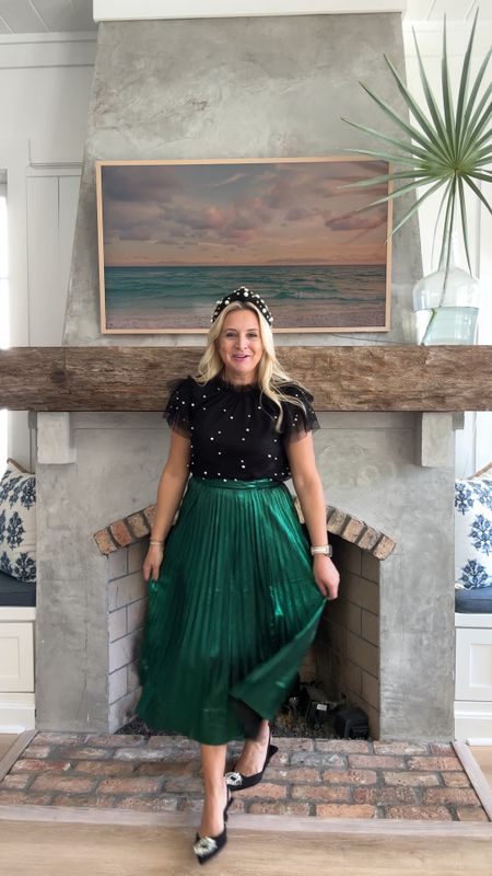 Loving this green pleated skirt for all things holiday. This pearl top is a great holiday staple that you can wear dressed up or dressed down. Wearing small in top and skirt. Use code FANCY15 for 15% off  

#LTKHoliday #LTKstyletip #LTKSeasonal