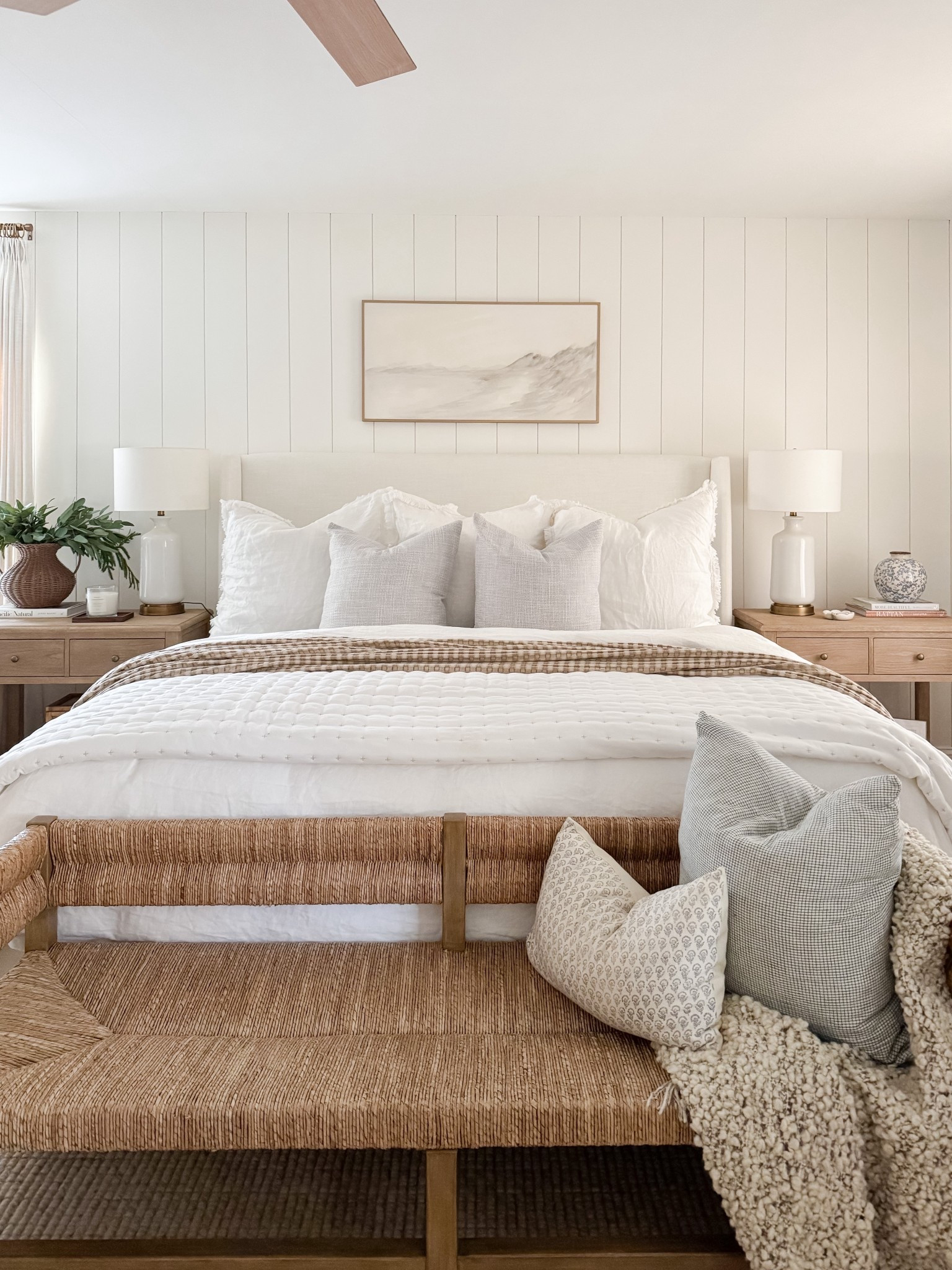 Layered bedding, warm wood tones, and soft textures make this coastal bedroom feel calm and complete. coastal bedroom decor, neutral bedroom, upholstered bed, woven bench, coastal home style, serene bedroom, timeless interiors, bedroom inspiration, sherricalnanhome

#LTKFindsUnder50 #LTKHome