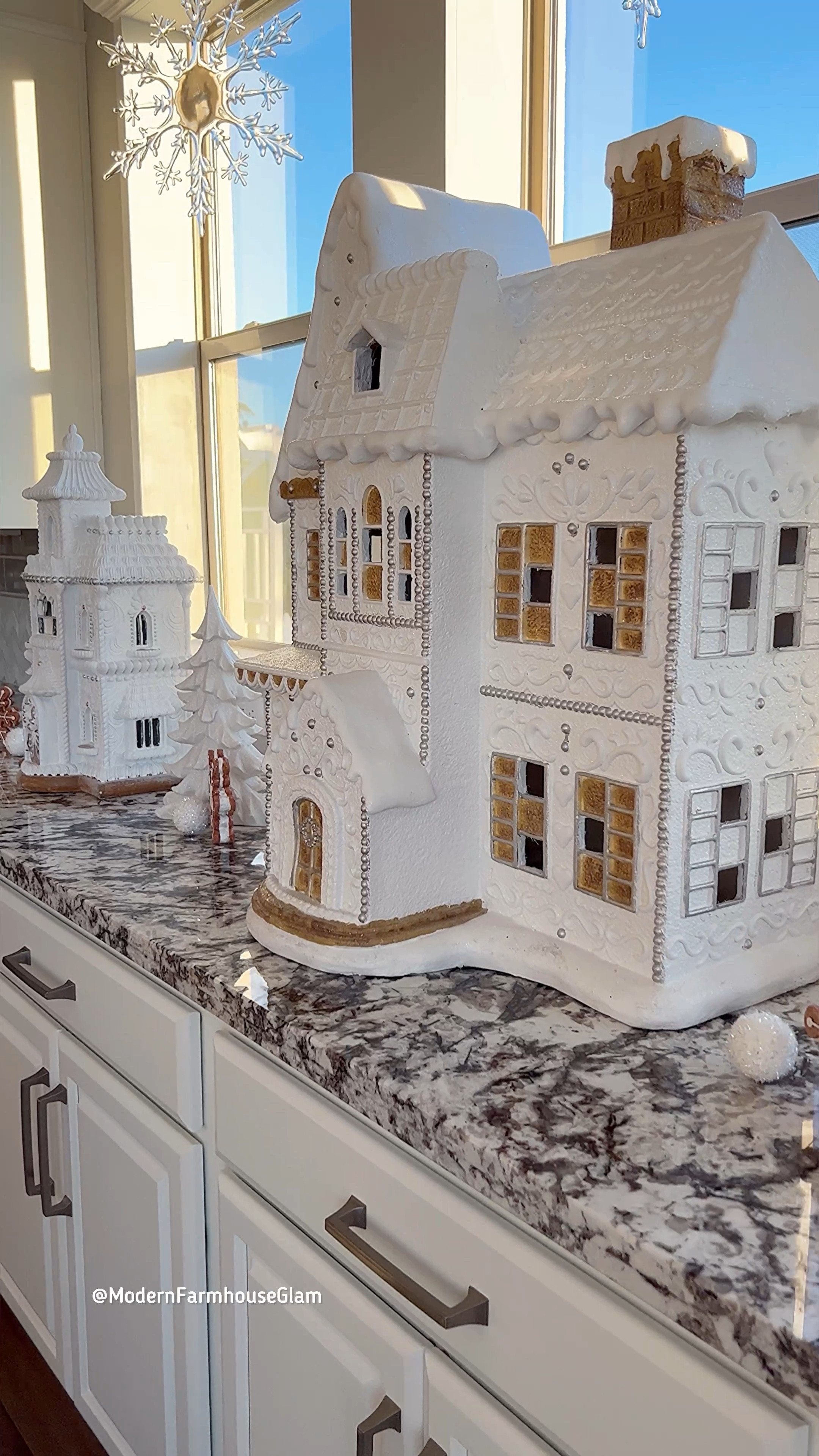 White gingerbread houses Christmas decor at Modern Farmhouse Glam. Dining room chandelier and neutral area rug. 

I linked my exact large acrylic hanging snowflakes, the gingerbread sandwich snowflake ornaments and white sparkly trees. I WISH I could link the giant houses, but sadly I can’t find them online and they’re nearly impossible to find in store, HOWEVER I did link some similar ones that are gorgeous! I linked my exact smallest gingerbread house on the right of the video!

Large gingerbread house. Snowflake ornament. Crystal chandelier. White and grey neutral dining room rug. Flocked Christmas tree  

#LTKHolidaySale 

#LTKhome #LTKVideo