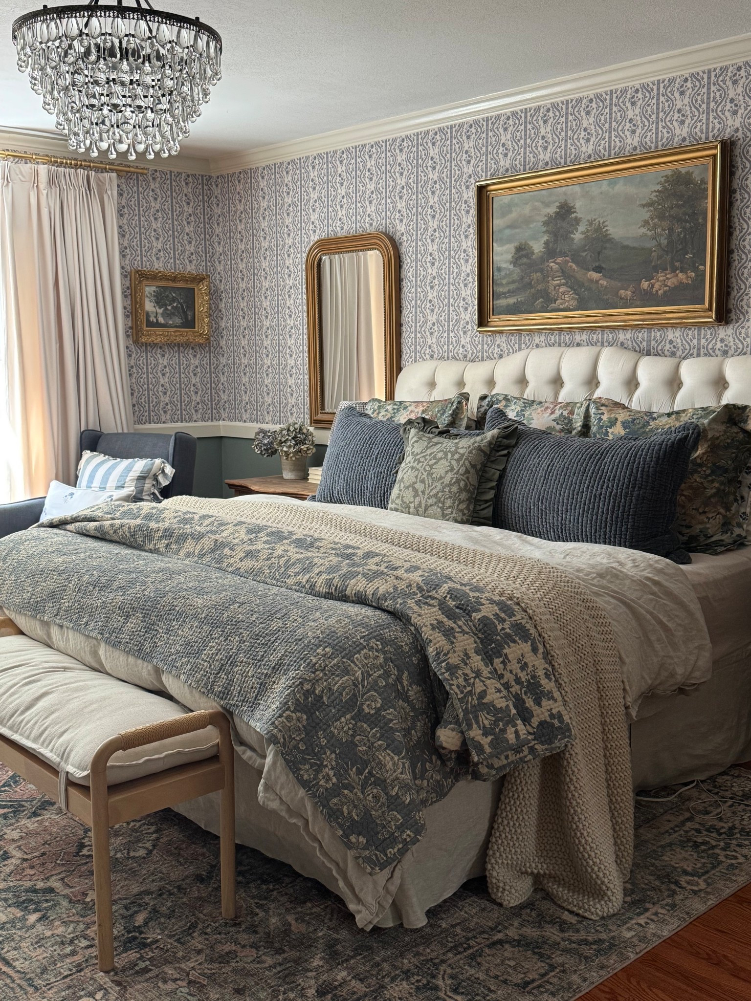 Cozy fall bedroom inspo. Cottage style bedroom. Layered bedding, reversible quilt, crystal chandelier, wallpaper, rug, velvet reversible sham, linen duvet, linen bedskirt, arched gold mirror, velvet curtains

#LTKSaleAlert #LTKHome #LTKSeasonal