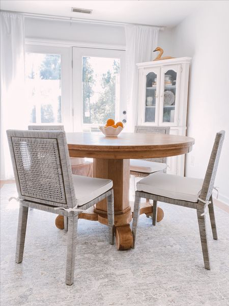 Gray washed rattan dining room chairs and surya area rug

#LTKsalealert #LTKhome #LTKstyletip