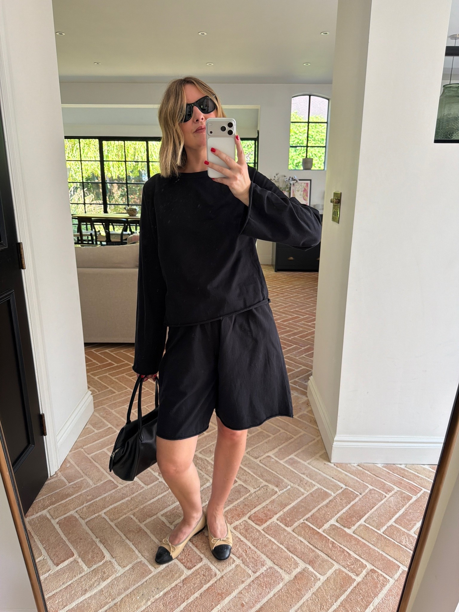 black matching set, black long sleeve top, black bermuda shorts, coordinated shorts set, oversized fit set, tonal black outfit, two-tone ballet flats, cap toe flats, black leather handbag, structured tote, black sunglasses, monochrome outfit, quiet luxury, elevated basics, effortless summer style, minimalist off duty look, weekend uniform, ltkstyletip, ltkseasonal, ltksummer, ltkfindsunder100, outfit inspo, capsule wardrobe essentials

#LTKsummer #LTKtravel #LTKeurope