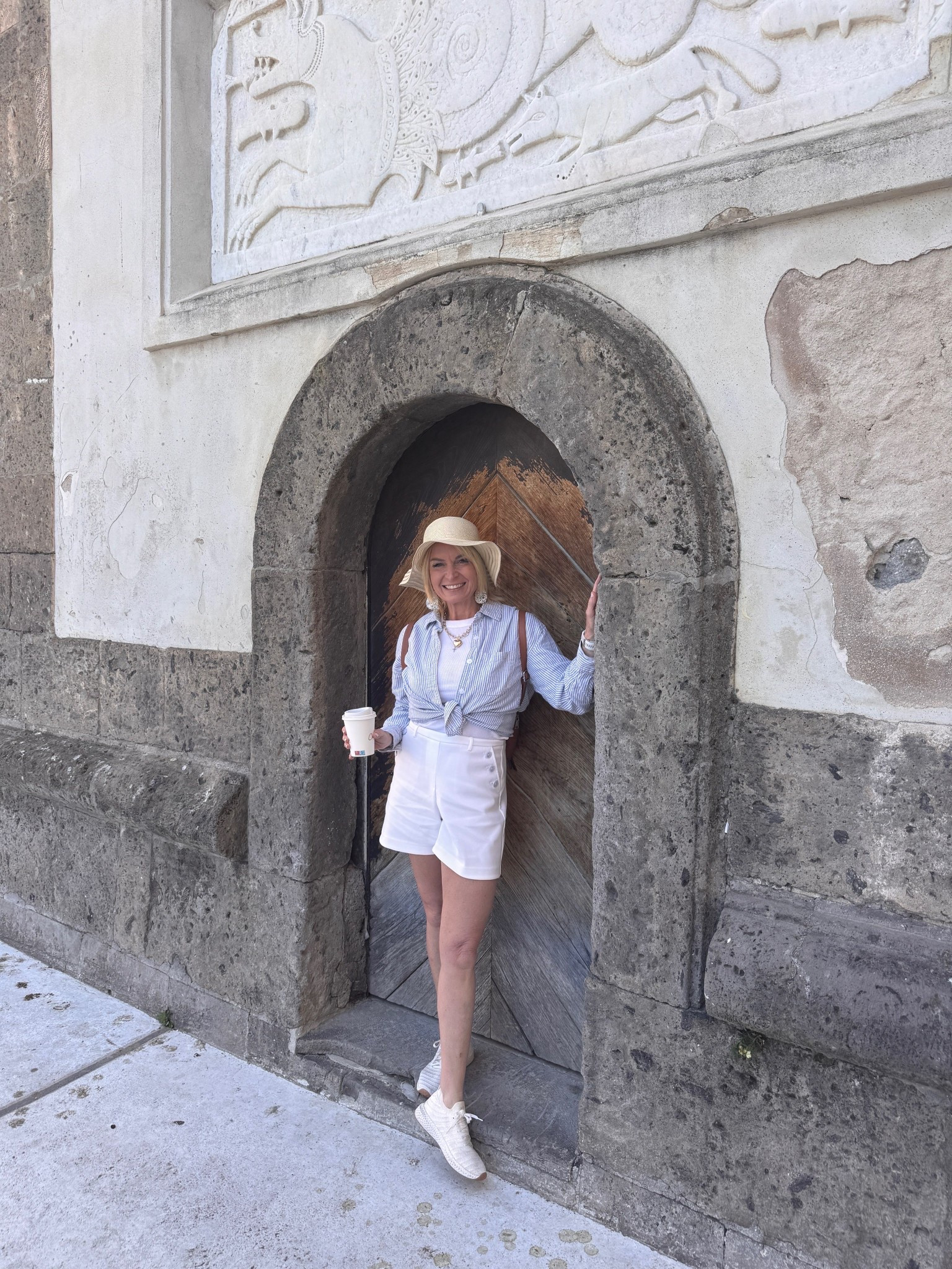 I love this blue and white oversized striped shirt that I tie at the bottom, a white tank underneath & paired with some crisp white stretchy shorts!! Perfect outfit for seeing all the sights!! Don’t forget your white walking shoes!!! 

#LTKTravel #LTKOver40