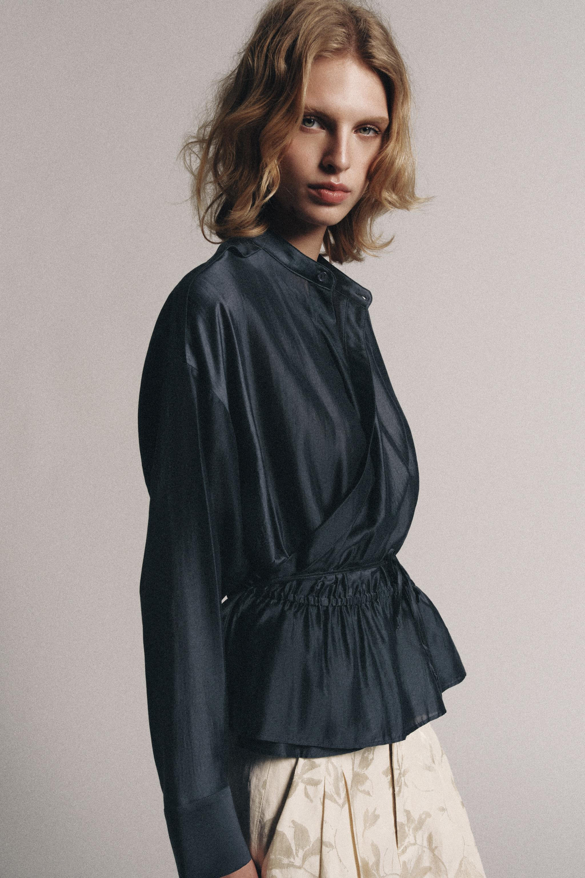 ZARA WOMAN COLLECTIONBlouse made of a lyocell blend yarn. Round neck and short sleeves with cuffs... | Zara US