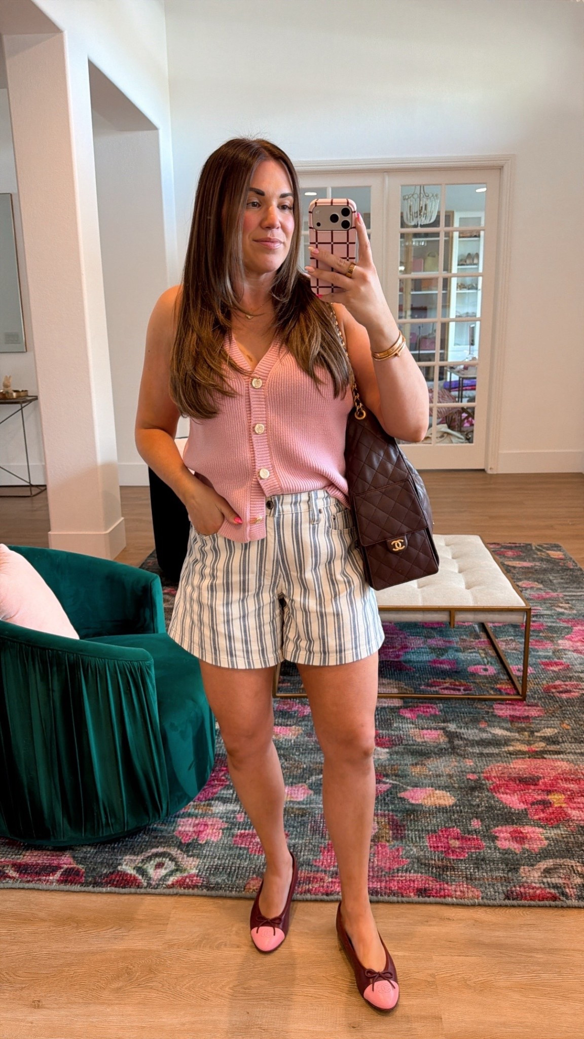 curvy midsize spring outfit! wearing size large on pink sweater vest and size 30 in blue and white striped shorts 

#LTKMidsize #LTKSeasonal