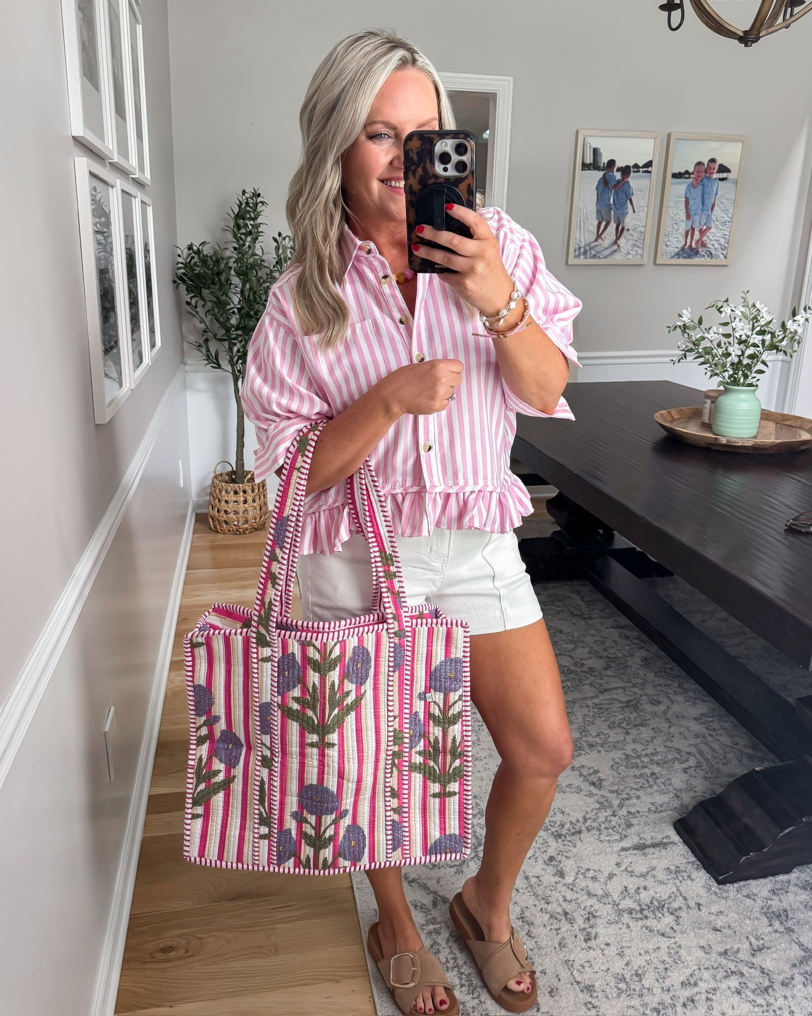 This pink striped top is such a fun statement piece for summer. I love how the ruffle hem and bright stripes instantly dress up a simple pair of white shorts, and this floral tote adds the perfect pop of color for vacations, brunch, and weekend outings.

pink striped top, white shorts outfit, summer fashion, vacation style, colorful tote bag, resort wear, casual chic outfit, brunch outfit, feminine summer style, vacation outfit inspiration, everyday summer look, lovelylifestyling

#LTKSeasonal #LTKTravel #LTKootd