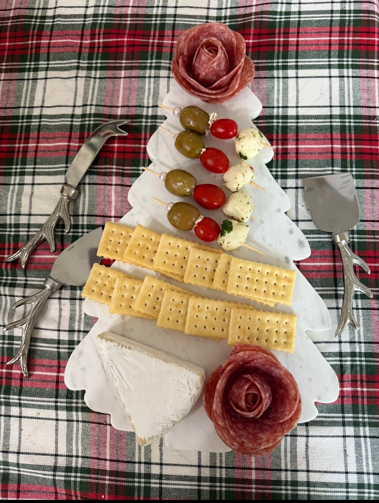 Marble Christmas tree charcuterie board. Marble Christmas tree cheese board. Christmas cheese knives. Antler cheese knives. Tartan plaid tablecloth. Christmas hosting. Christmas entertaining essentials. 

#LTKHoliday #LTKFindsUnder50 #LTKHome