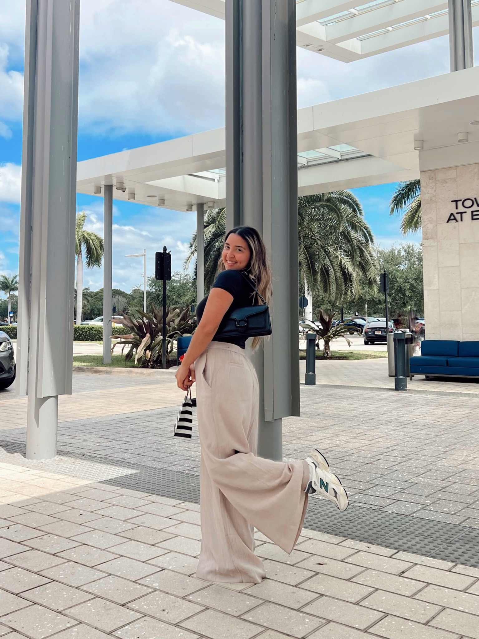 Effortless chic: pairing a black Abercrombie bodysuit with beige trousers and New Balance 9060 sneakers. This neutral outfit is perfect for spring! Find more #ootd inspiration on my blog. #ltkstyle #casualchic #newbalance #abercrombie #neutraloutfit #springfashion #ootdinspo #fashionblogger #styleblog 