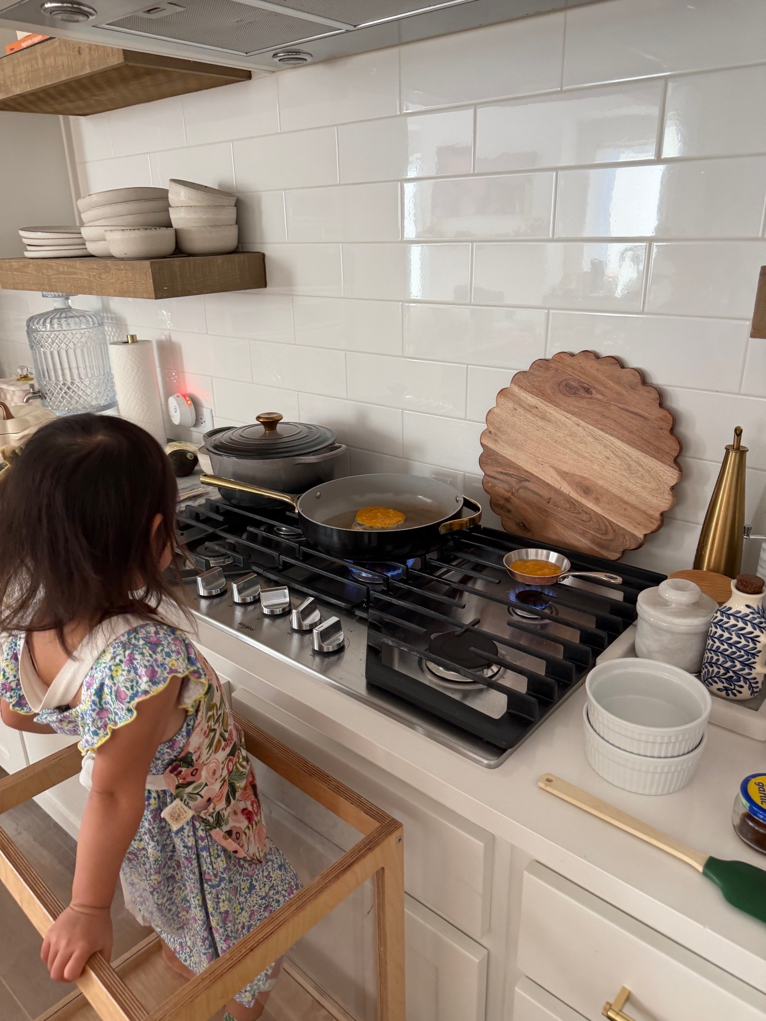 Cooking with my 3-year-old thanks to a toddler tower to bring her up to the counter height, a floral apron she loves and cookware her size.

#LTKHome