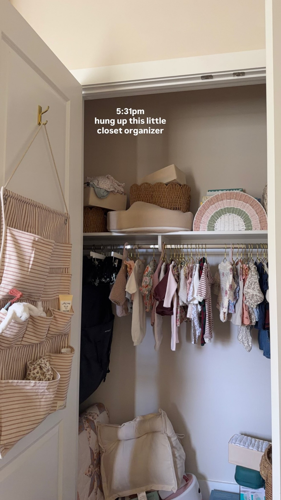 hung up this little closet organizer in her nursery