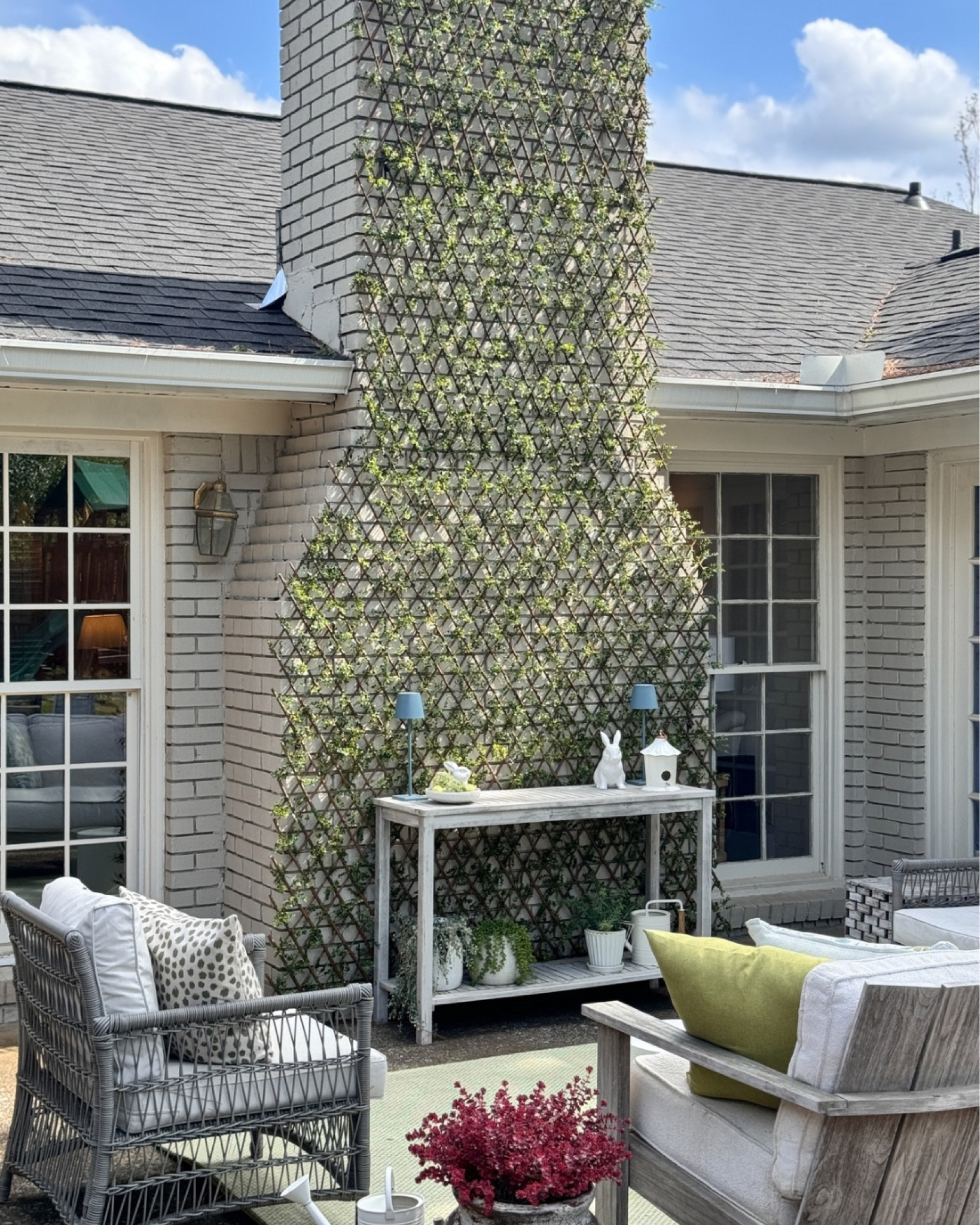 DIY faux garden trellis wall on brick! Loved how this turned out. I used 4 of the expandable bucus style faux greenery trellis grids here. Turned out so well! Hasn’t budged all year through the weather! I zip tied the grids on the brick clips for extra security! 

#LTKHome #LTKFindsUnder100 #LTKStyleTip