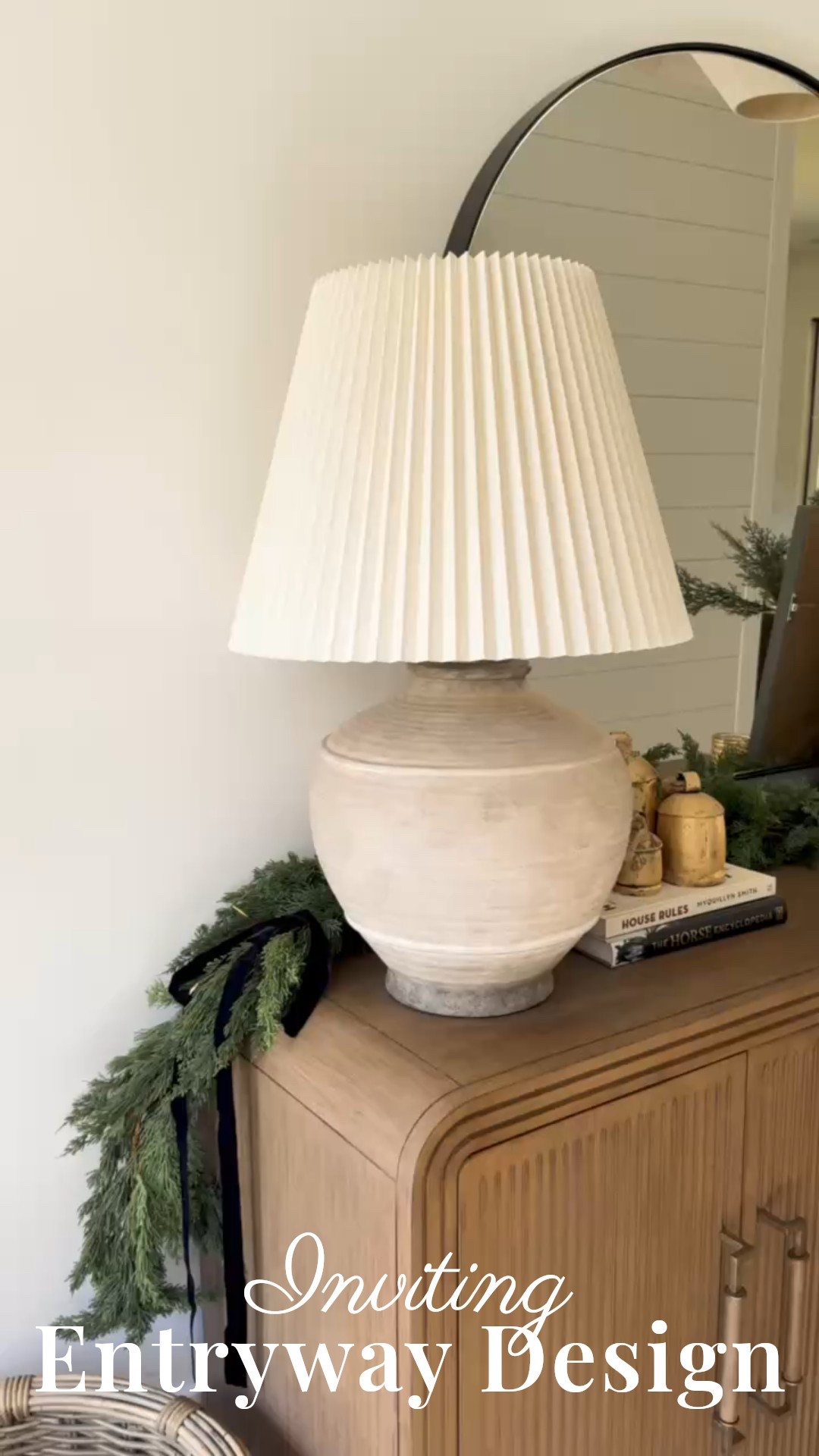 ✨ Want your entryway to feel warm, intentional, and beautifully styled the moment you walk in?
This Modern Classic setup features a ribbed wood console, sculptural ceramic lamp, oversized arched mirror, layered artwork, natural greenery, and textured accessories that create a calm and welcoming atmosphere. A perfect blend of timeless design, organic materials, and subtle seasonal touches.

#porcheandco #modernclassicentryway #entrywaydecorideas #archedmirrorinspo #texturedtablelamp #consoledecorstyling #woodtonefurniture #layeredartdecor #homesenseinspo #neutralhomeaesthetic

Do you want to bring our dreamy Modern Classic style interior design into your own home? 🏡 You’re in luck! Reserve our Online Interior Design packages today -> https://porcheandco.com/edesign ✨ We can’t wait to work with you & design your home with #porcheandco


#LTKHoliday #LTKSeasonal #LTKHome