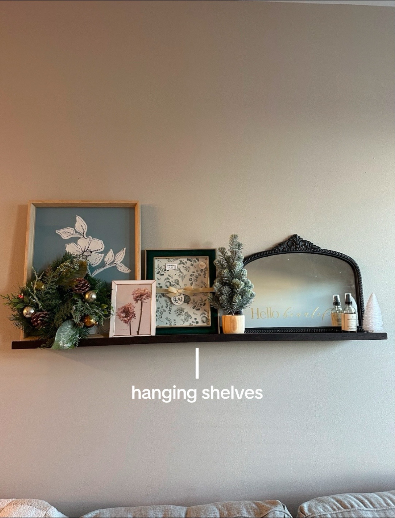 Hanging shelf for photos living room

#LTKHome #LTKSaleAlert