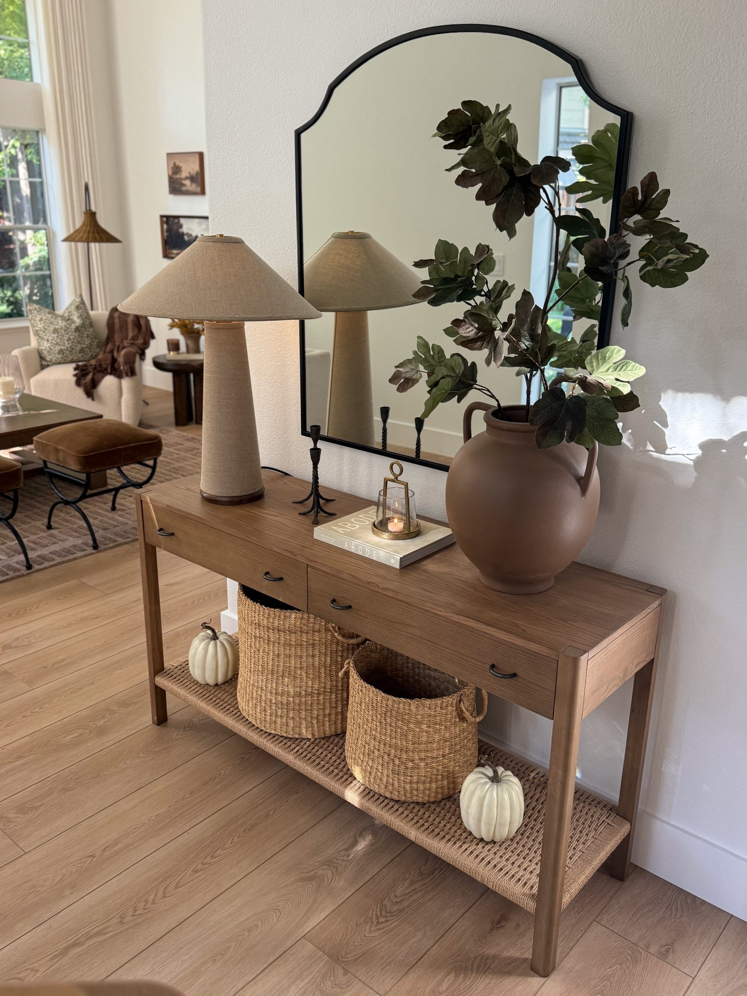 Entryway styling. Warm wood tone console table, linen lamp, statement ceramic vase, fall stem, candle holders, storage baskets, fall decor. 


#LTKStyleTip #LTKHome #LTKSeasonal