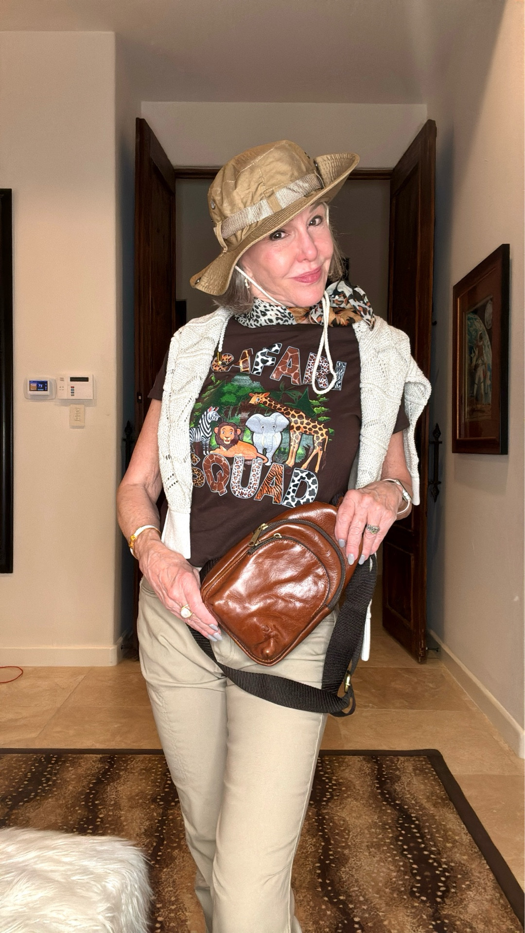 I found these adorable Safari graphic t-shirts for $15. They have great stretch so I chose to order a size small for a more fitted look. They come in other colors as well. Layering in essential so I threw in my  pen  knit hoodie. My genuine leather sling bag is the perfect size for essentials while traveling. Passport, Phone, cash, lip balm, tissue, sunglasses, hand hand sanitizer and whatever you reach for regularly. This safari hat was under $10. It easily folds up for packing. 

#LTKStyleTip #LTKFindsUnder50 #LTKTravel