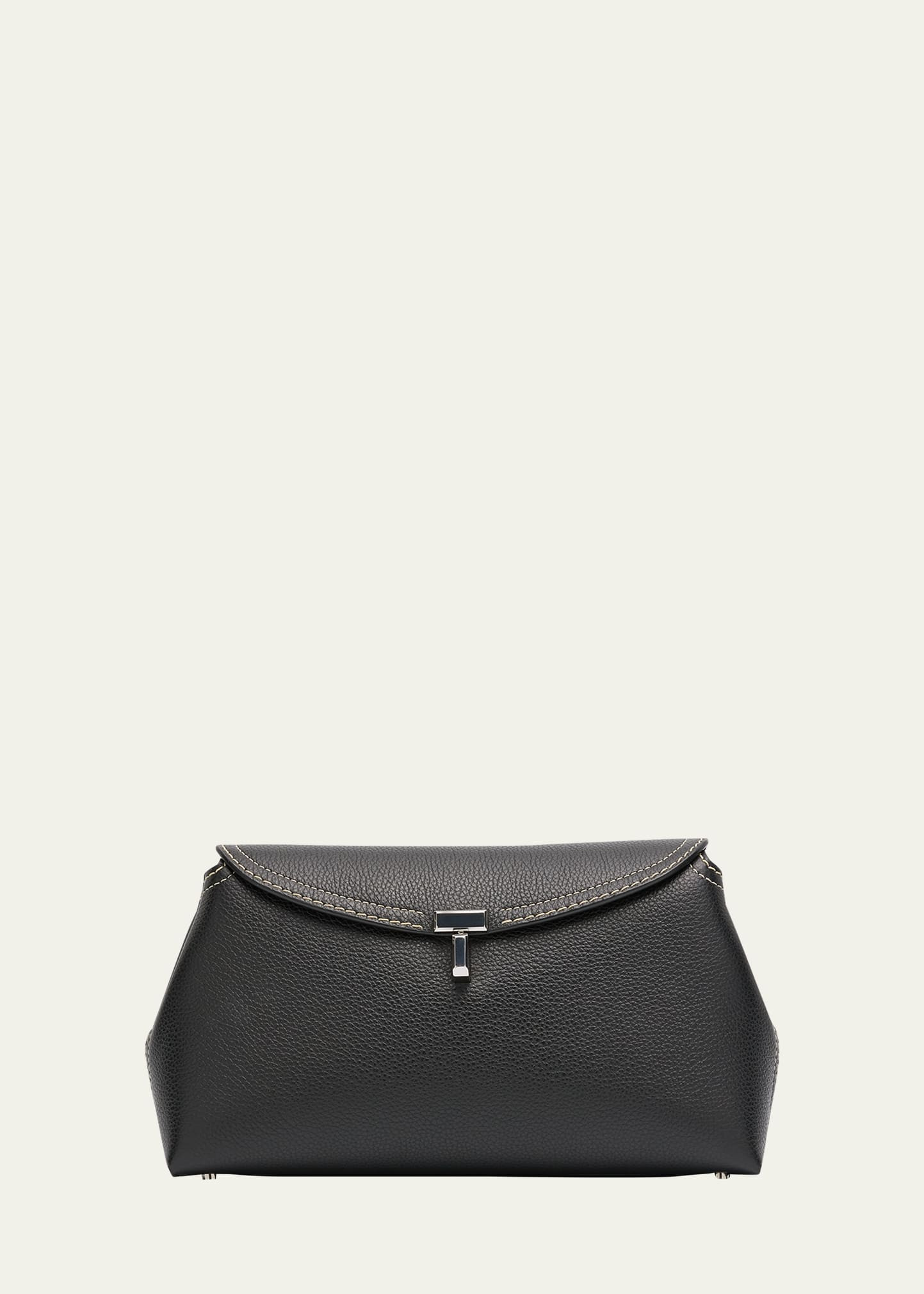 Toteme T-Lock Clutch Bag in Pebble Grain Leather | Bergdorf Goodman