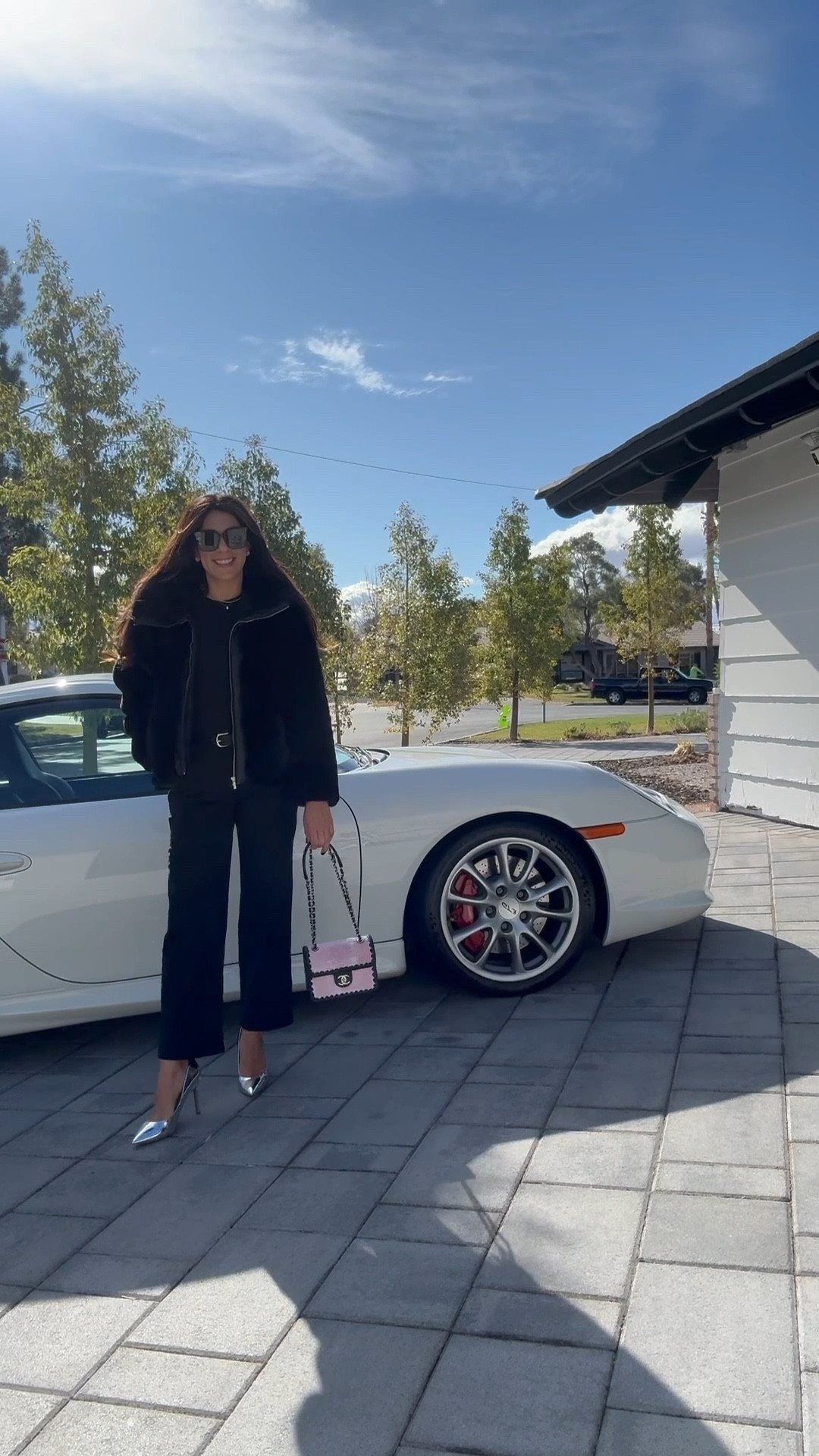 Effortless and chic—monochrome black with a luxe twist. The faux fur bomber and high rise wide leg cropped pant to add edge, while silver heels and a pink Chanel mini bag bring the perfect pop of glam.

#LTKFindsUnder50 #LTKSeasonal #LTKStyleTip