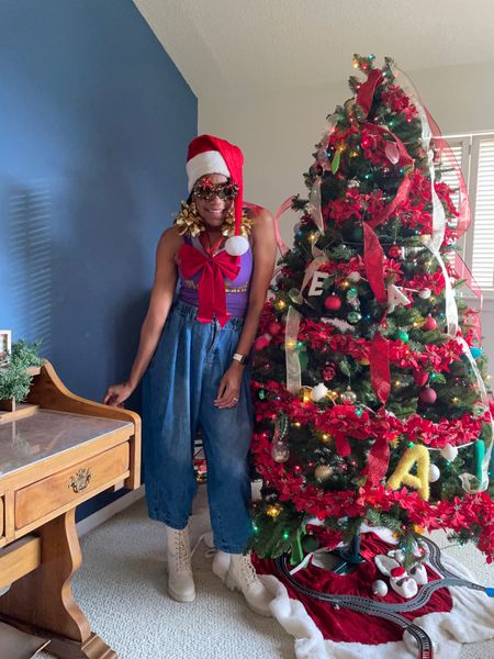 Dress like a Christmas tree
Ribbon +
Long tail Santa hat +
Tinsel wreath glasses
+
Poinsettia garland 

#LTKhome #LTKHoliday #LTKSeasonal