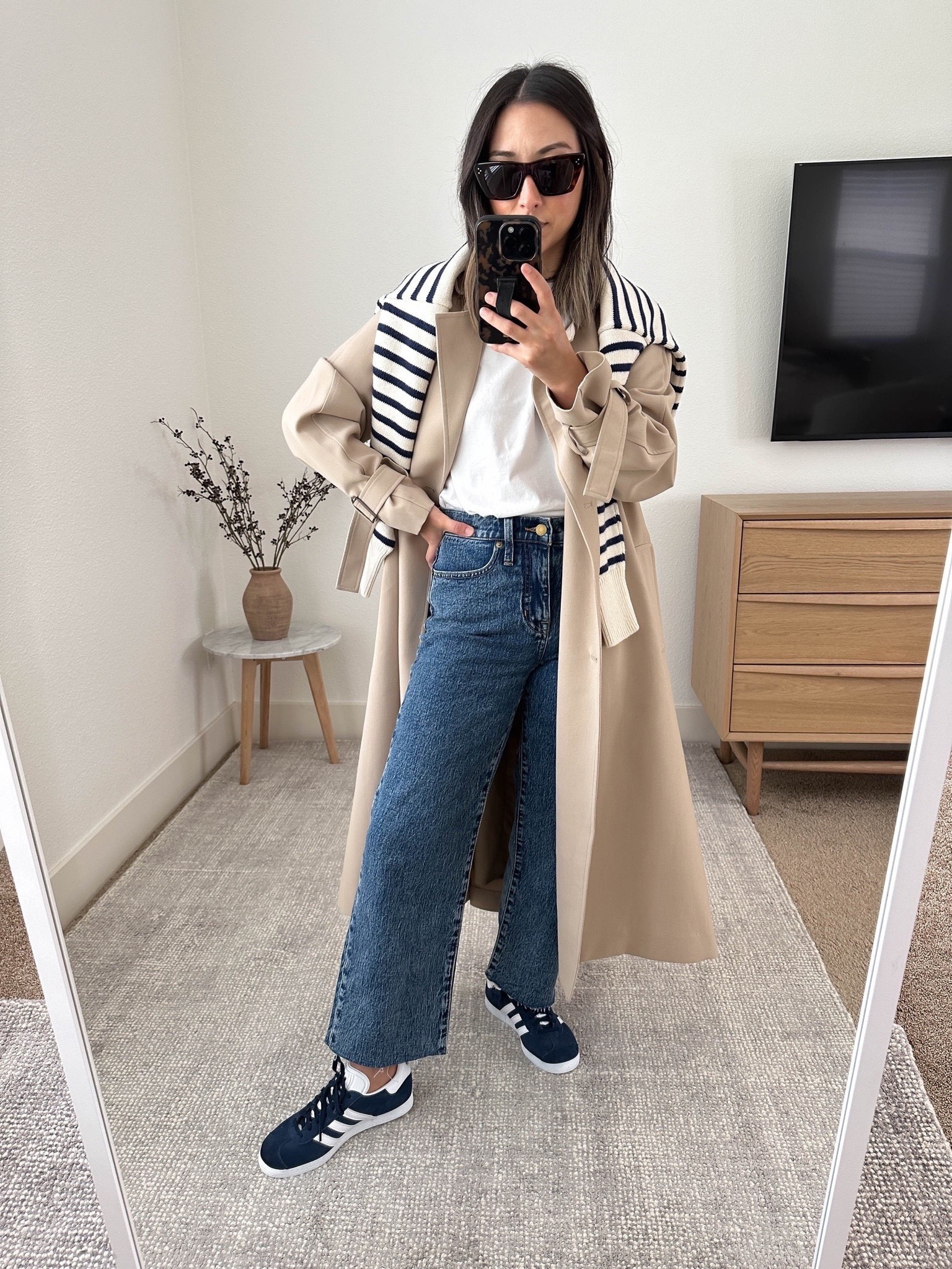 New adidas gazelle sneakers in. Been wanting more navy in my life and I LOVE THESE!  Run tts. I went with a men’s 4. 

Oak & Fort trench xxs
Everlane box cut tee medium
Jcrew jeans petite 24
Adidas gazelle sneakers 4 men’s. 
Minnow swim sweater small. Runs small. 
Celine sunglasses 

Sneakers, jeans, petite style, trench coat 

#LTKshoecrush #LTKSeasonal