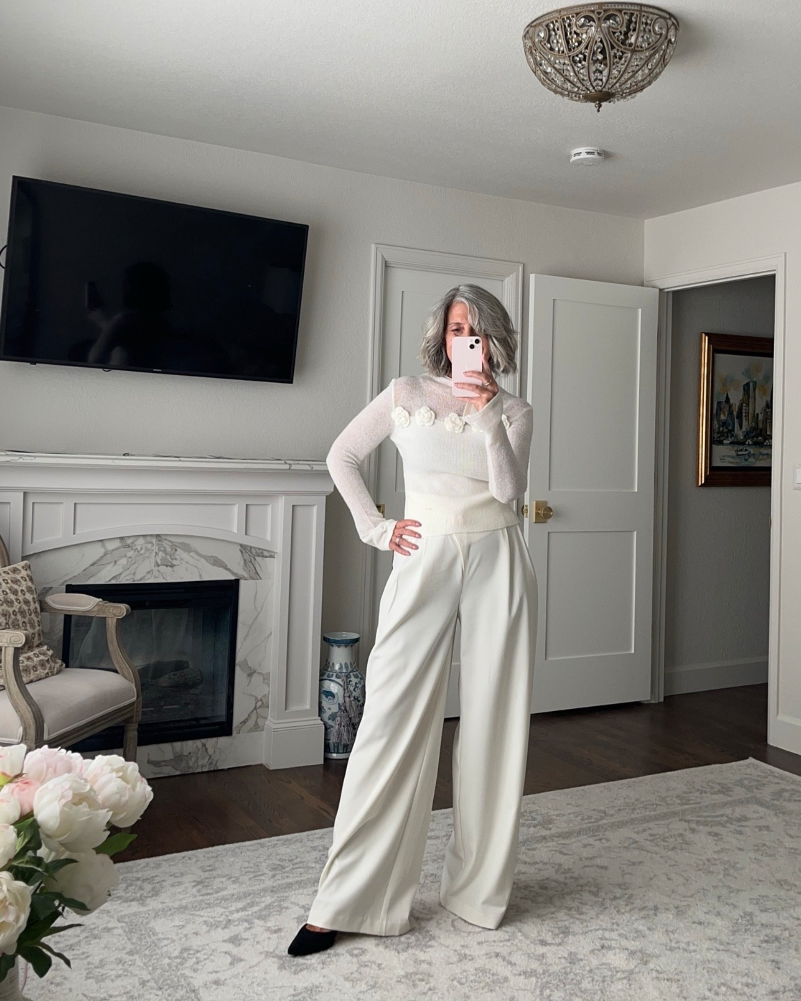 Have you ever wanted an outfit that conveys a sense of trust and approachability while still looking incredibly polished? The problem with some professional wear is that it can feel stiff and uninviting. This soft, flower-embellished knit top paired with the sleek trousers is a lovely solution. The delicate floral details add a gentle touch, while the sleek silhouette maintains a sophisticated air, creating a look that is both warm and elegant.

This outfit is ideal for a day of client meetings or a presentation to a new team. It shows that you are a consultant—someone who is respected for their expertise and trusted for their advice. 

Use Code: emptyneststyle_12 for 12% off

I am typically a medium, and I find that these pieces all fit true to size.

Ready to feel graceful and professional? 

Shop the look by tapping the links below.

     

white sweater, detailed top, business chic, workwear elegant 

 

#LTKSeasonal #LTKOver40 #LTKWorkwear