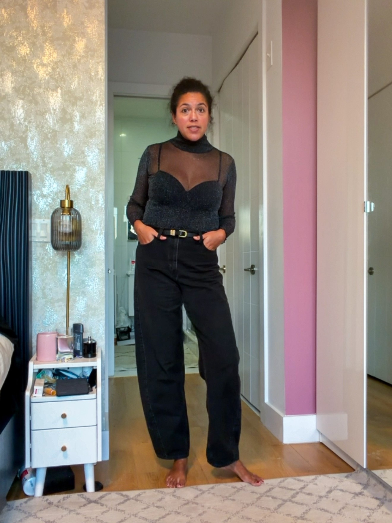 Snagged a screenshot of the video, so the quality isn’t great - but I loved this outfit! A sparkly mesh turtleneck over a black shell, tucked into black barrel jeans cinched with a thin belt. Simple gold jewelry and black boots completed the look!
Top: Jonathan Simkhai, size large
Shell: Hanro, size 36D
Jeans: Gap, size 30 Tall

#LTKMidsize #LTKgrwm #LTKTall