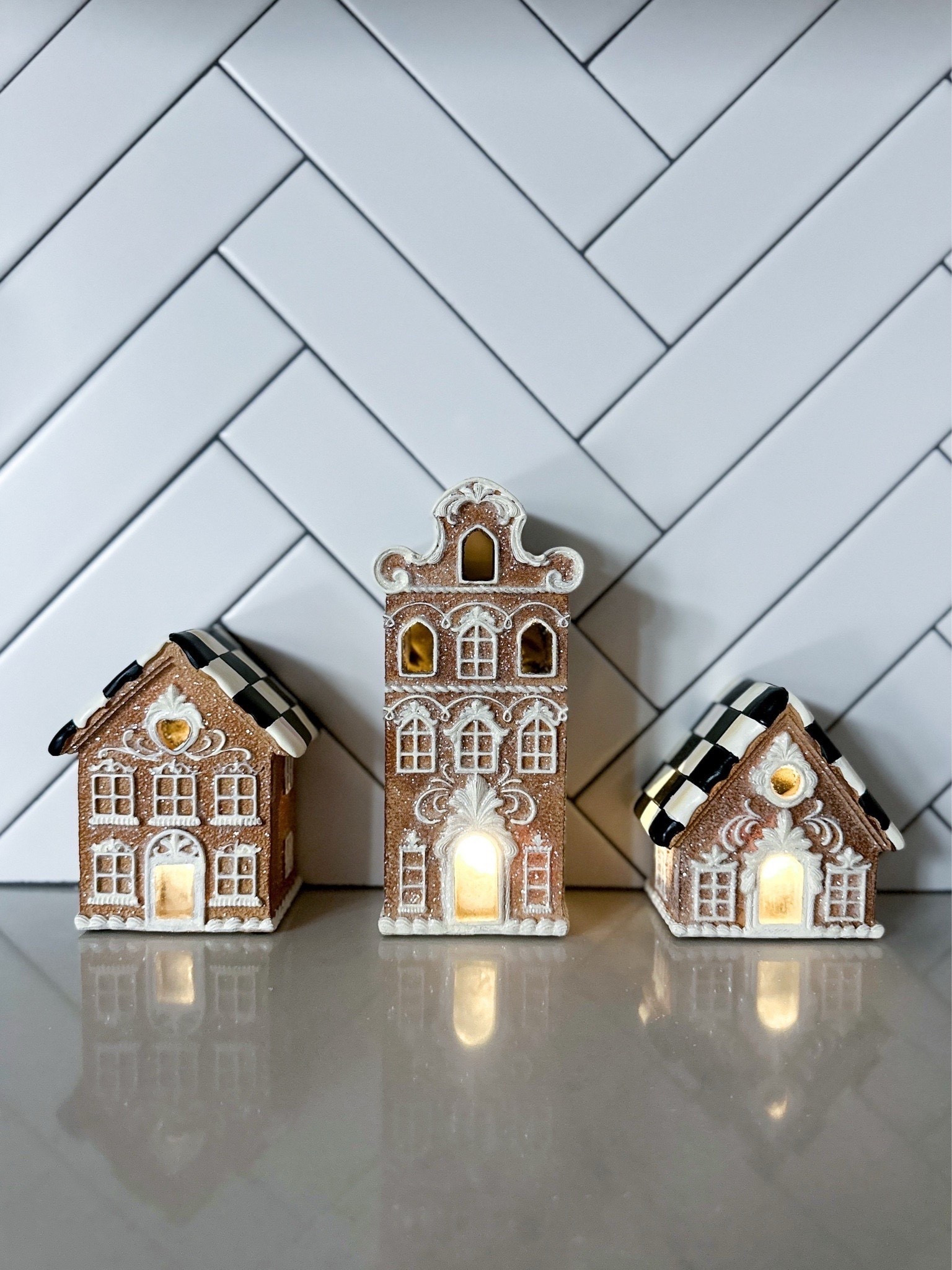 Our McKenzie-Childs gingerbread houses are some of my favorite Christmas pieces to bring out every year. The detailing is so sweet in person & the glow is even prettier at night. They’re the perfect little moment for a kitchen counter, a shelf, or tucked into a holiday village setup.

McKenzie Childs gingerbread houses - Holiday kitchen decor - Christmas gingerbread village - Cozy Christmas home - Neutral holiday decorating - Christmas counter styling - Classic holiday accents - Gingerbread house decor - Warm Christmas glow - Holiday home inspiration - McKenzie Childs holiday - Collectible Christmas decor - Whimsical holiday pieces - Christmas shelf styling - Holiday kitchen ideas - Christmas home favorites - Elevated Christmas decor - Charming holiday finds - Christmas village display - Cozy winter home style

#LTKHome #LTKSeasonal #LTKHoliday