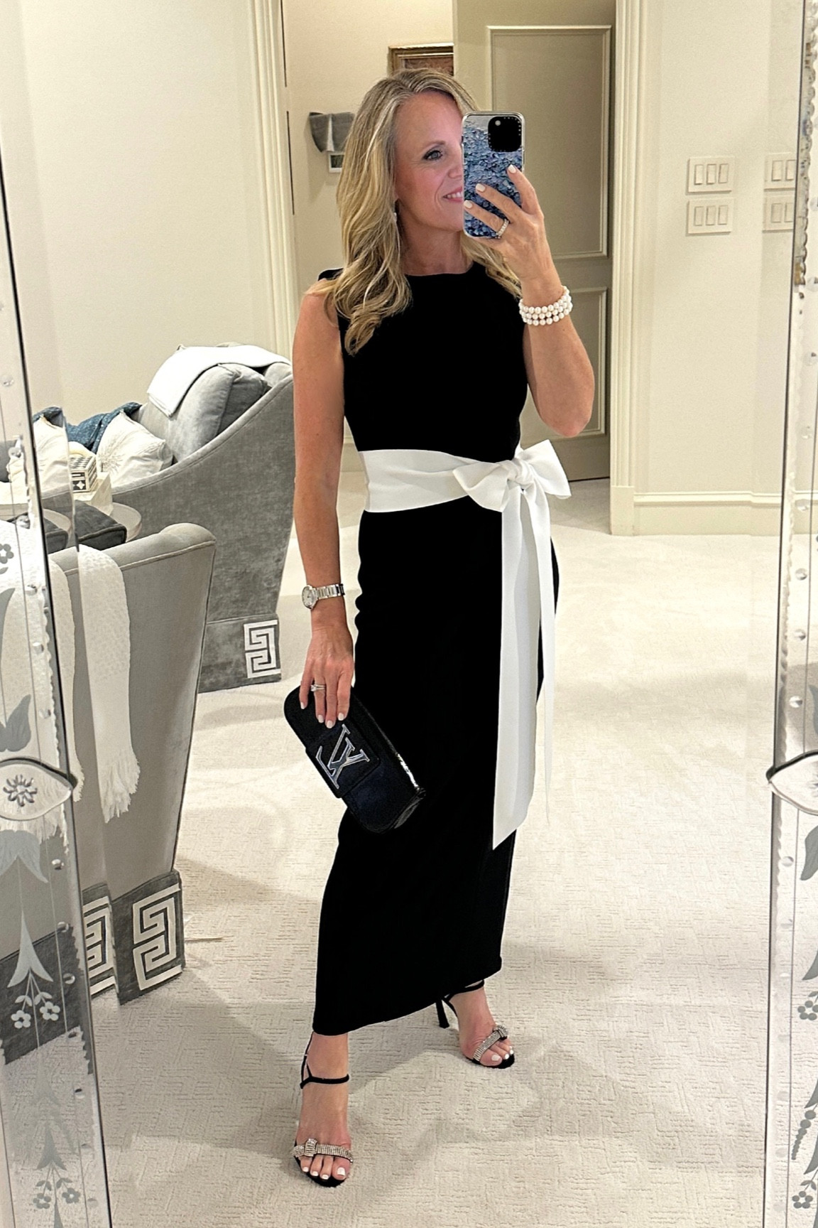 Christmas party / Holiday outfit inspiration!
Black and white midi sheath dress with white bow shash 
Fits slim so I sized up one 
I’m 5’2” tall for length reference 
Schutz black suede and crystal sandals 

#LTKStyleTip #LTKOver40 #LTKHoliday