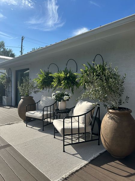 Pottery barn wrought iron hooks but way less expensive on Wayfair!!! I got my hanging pots from Lowe’s. All linked here! Neutral earthy patio vibes. Outdoor furniture and rugs. Planters. Olive jar planters  

#LTKSeasonal #LTKhome