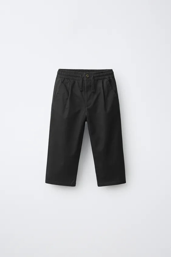 Trousers featuring an elastic waistband with adjustable front drawstrings. Front button closure. ... | Zara US