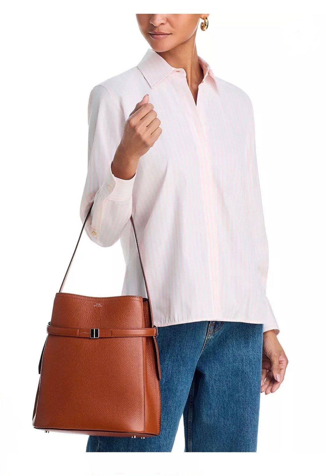 TOTEME
Belted Leather Bucket Bag

This modern bucket bag is set with an elegant belt that creates sculptural side folds and can be opened for extra space. Crafted in Italy, from pebble-grained leather and metal hardware trim, it has a spacious interior secured with a lobster clasp.

#LTKootd #LTKWorkwear #LTKTravel