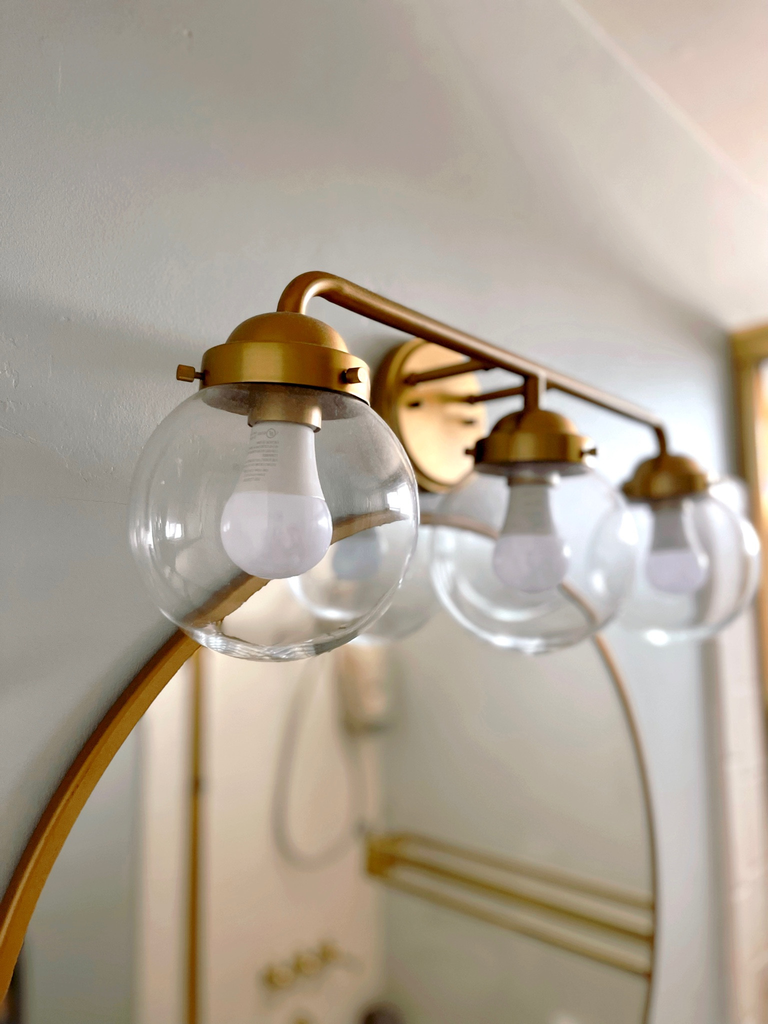 Bathroom brass lighting and mirror renovation project

#brasslighting #brassmirror #bathroomdecor

#LTKfamily #LTKhome #LTKunder100