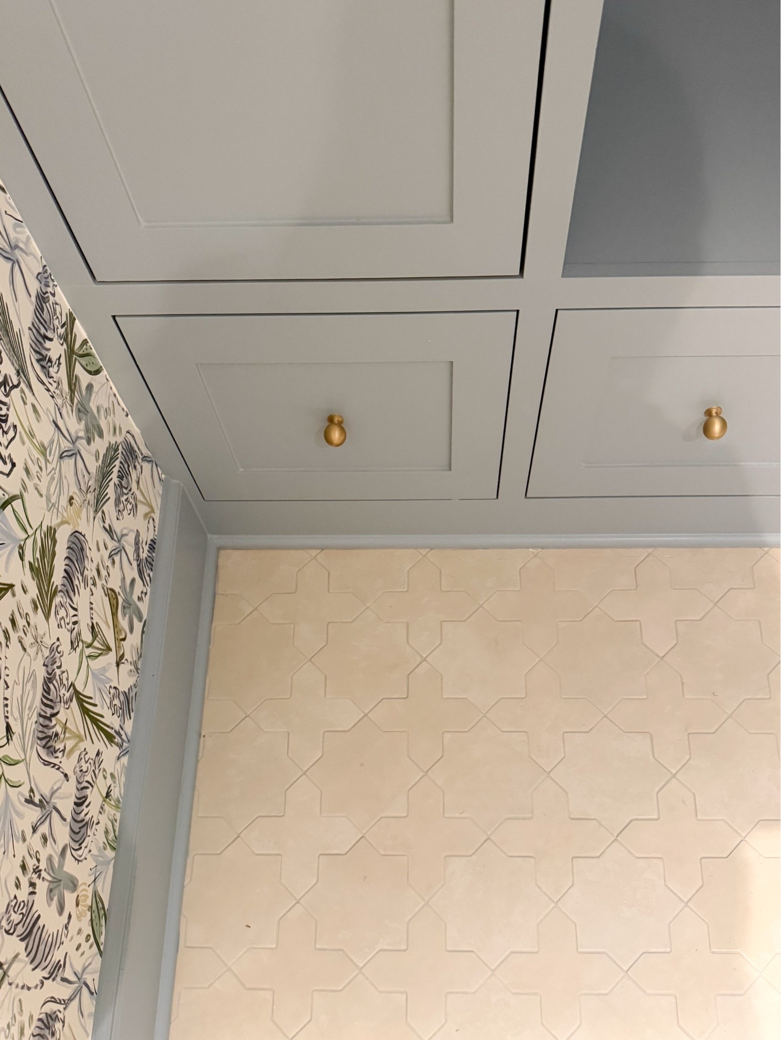 We wanted the floor to have personality without competing with the tiger wallpaper, and this star and cross tile was the perfect balance. We used a similar grout color for a soft, tonal finish that lets the pattern quietly stand out.

powder room tile, star and cross tile, bathroom flooring, patterned tile, powder room design, small bathroom ideas, blue bathroom, statement wallpaper, interior design, Girl on the Hudson

#LTKSeasonal #LTKHome