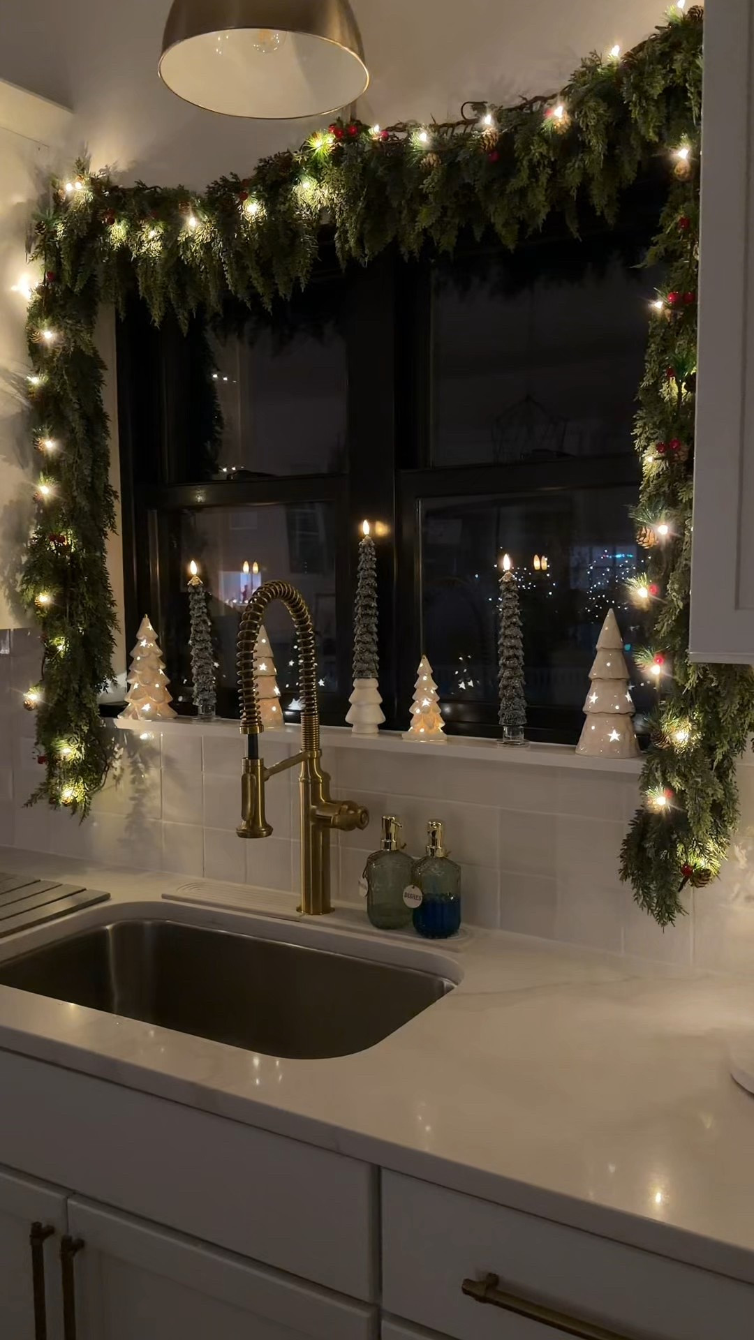 Christmas kitchen window decor! I have 2 of the 6 foot garlands and 2 sets of the string lights here


#LTKHome #LTKHoliday