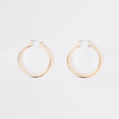 Gold tone chunky round hoop earrings | River Island (UK & IE)