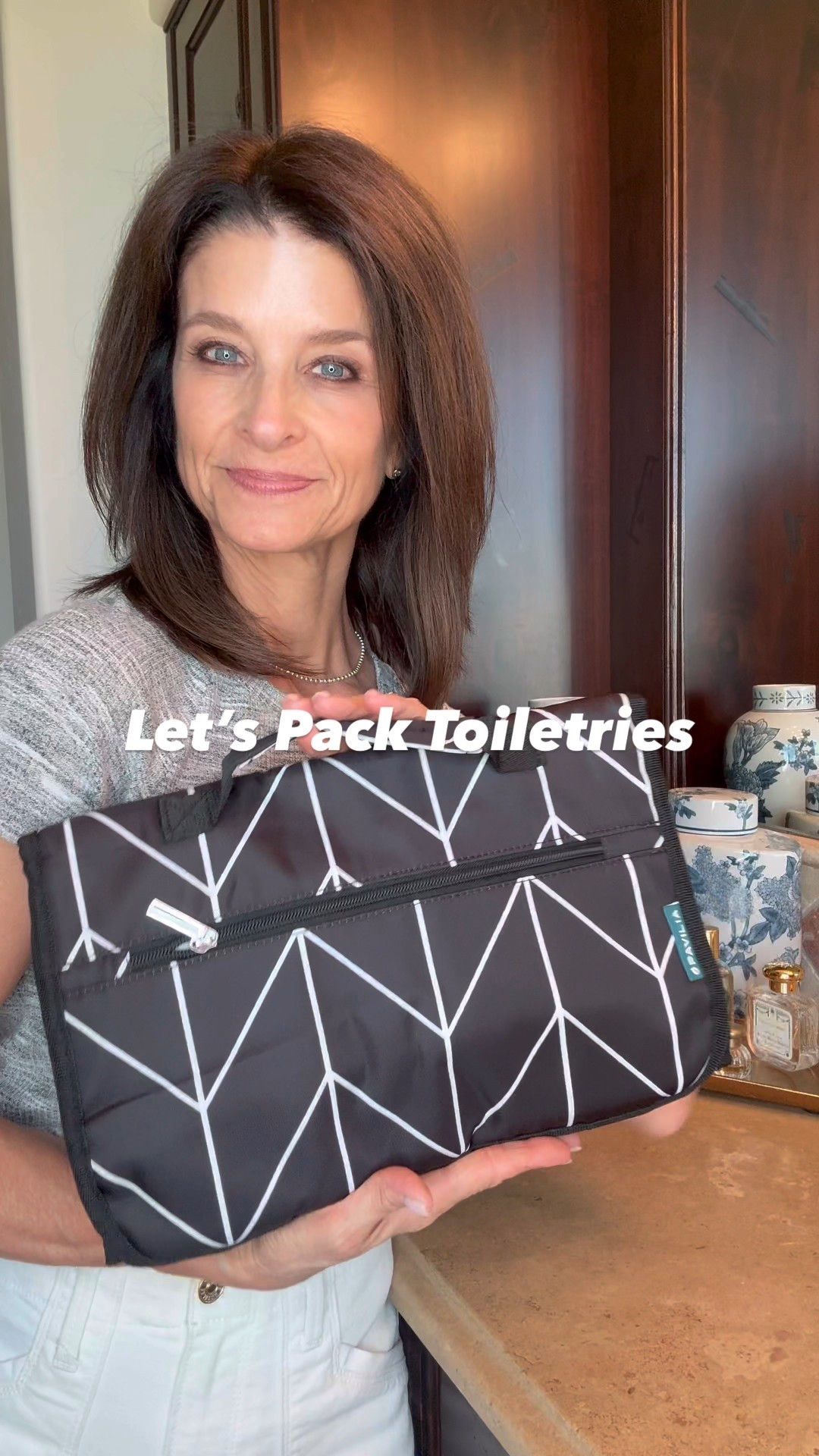 Let’s Pack Toiletries!
Packing light and traveling with only a carry-on has its challenges.  Would it surprise you to hear me say that the clothes and shoes are the least of my worries?  One of the biggest issues for me is dealing with toiletries! 
Here are my tips for managing those darn toiletries and how I keep it all organized without monopolizing all the space in my suitcase.

- Pack my favorite, FLAT, hanging medicine cabinet for all of your non-liquid toiletries…Q-tips, nail files, razors, hair clips, contact lenses, dental floss, band-aids, etc.  The real bonus here is when a hotel room has limited counter space.  This hangs on a hook, keeping everything tidy and easy to find.  I pack this last, lying flat on top of my other items, just before I close up my suitcase.
- I use a clear TSA-approved quart-size zipper pouch or quart-size zip lock bag.  Either works great.  (Note:  If you are flying from London Heathrow, they are sticklers and will make you put your things into their 8 x 8 zip lock.  Do yourself a favor and grab some from Amazon ahead of time and beat them to the punch!)
- I minimize EVERYTHING, taking only the exact amount needed for the length of my trip.  Remember, 3.4 oz OR LESS!  And oftentimes, you do need less.  There is no limit to how many containers you can have in your TSA-approved quart-size zip bag, so be smart…you can bring a lot of different items if you strategically minimize.  I use plastic screw top jars, reusable liquid pouches, and tiny squeeze bottles.
- I use “bottle skins” to prevent leaks.
- I pack my dual-voltage travel hair dryer because I’ve been let down too many times by the hotel dryers, and I pack my “way too important to leave home” ghd dual-voltage flat iron.  
- And if you prefer, I’ve found a dual-voltage hair dryer brush that works great.

#LTKOver40 #LTKTravel