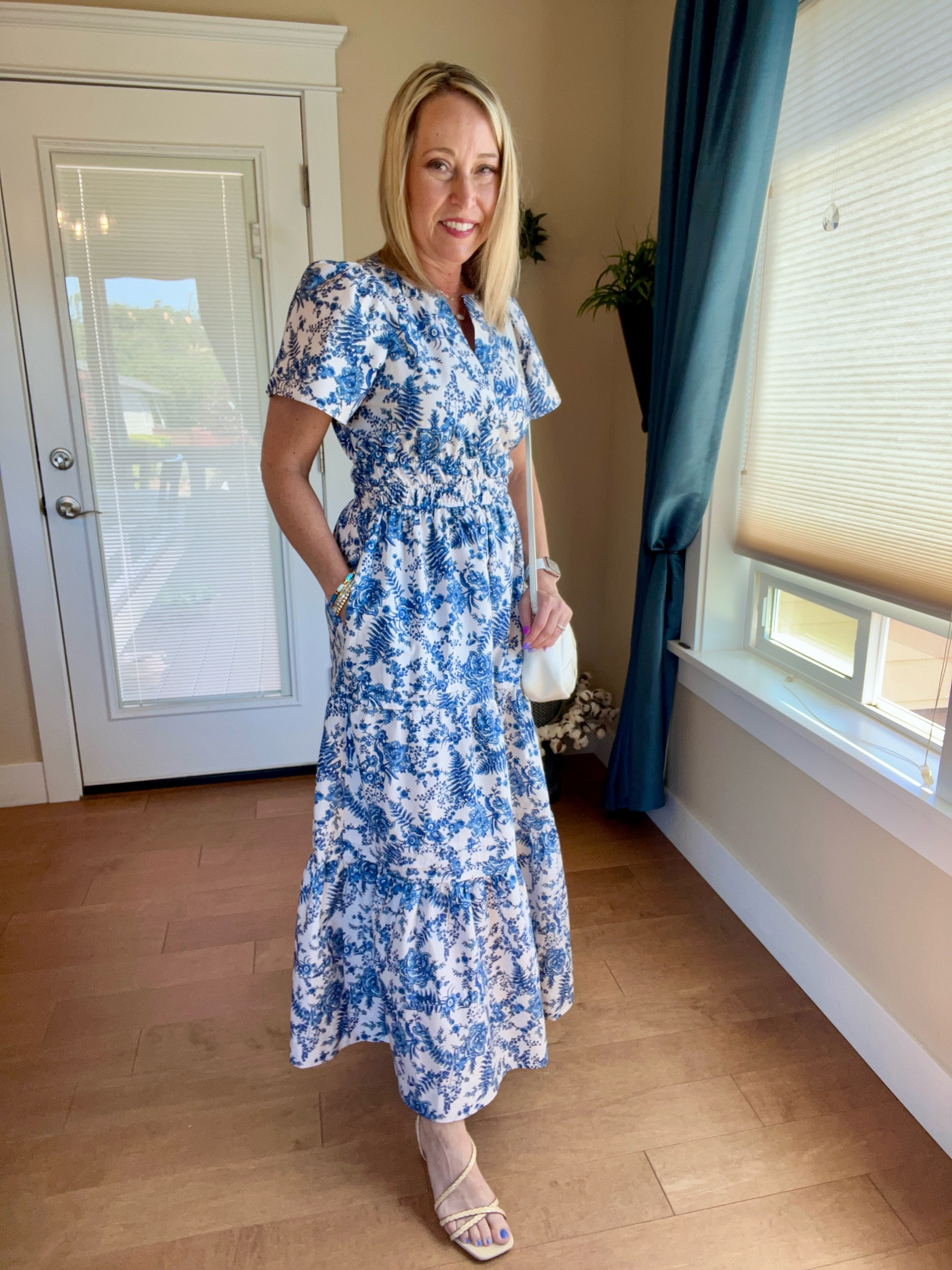 The dress that checks all the boxes! This blue and white toile print Somerset dress from Anthropologie comes in so many different colors and prints. Perfect for any occasion! 
Love the tiers, elasticized waist, pockets, and  puff sleeves. It’s fairly universally flattering. 

Complete the look with rafia strappy heels and woven crossbody bag both from Target. And my current favorite Elise pendant necklace from Kendra Scott. 

#LTKOver40 #LTKWedding #LTKStyleTip