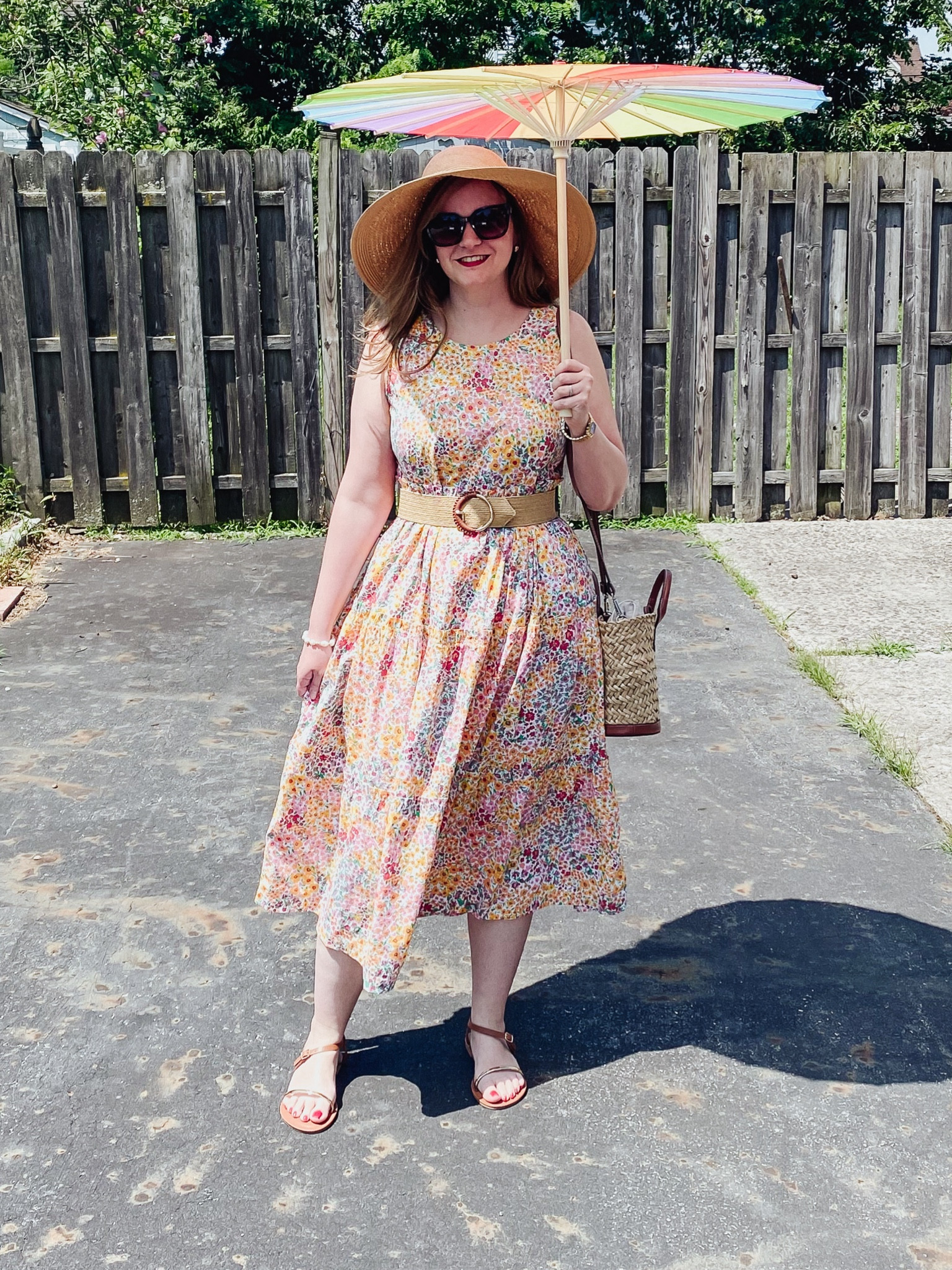 Straw hat 
Parasol 
Gold and brown sandals 
Straw belt 

#LTKSeasonal #LTKStyleTip #LTKShoeCrush