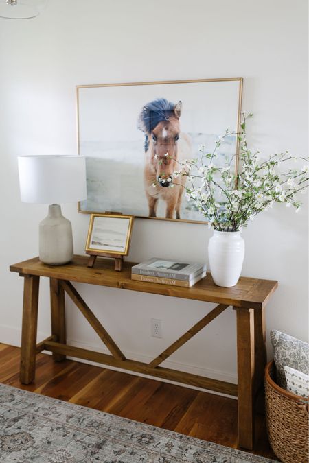 Our rustic console table is styled with an Amazon vase, concrete table lamp, artwork on an easel. 

#LTKstyletip #LTKFind #LTKhome