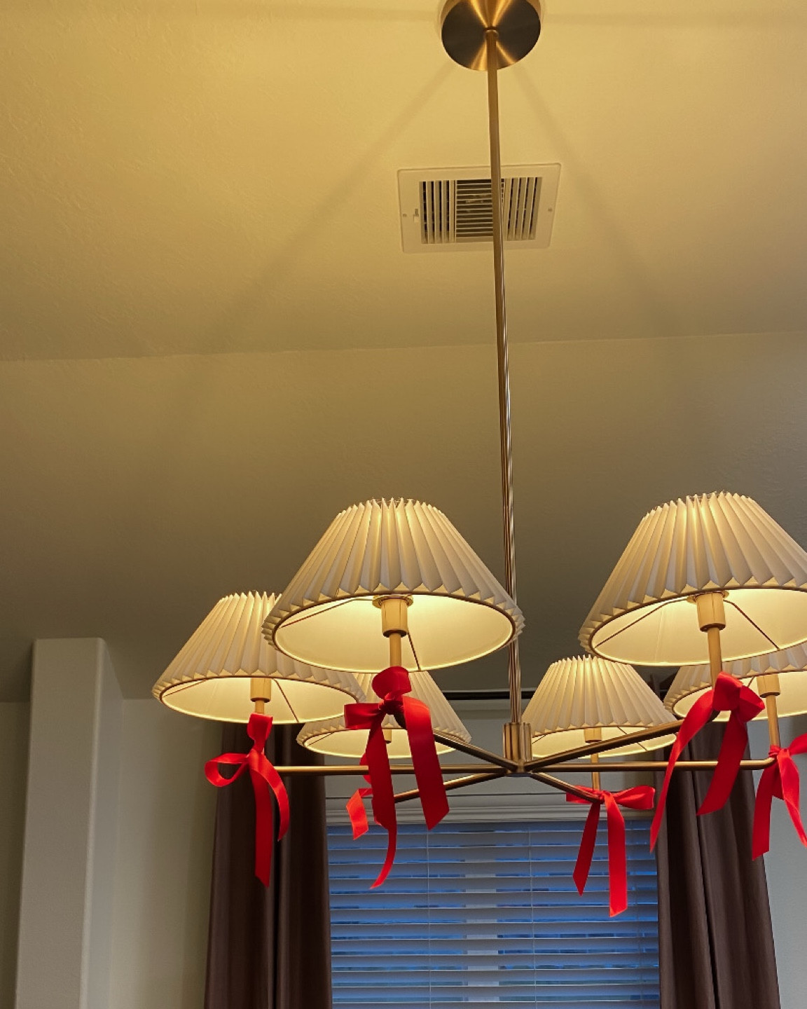 Anthropologie Home chandelier - had to add some bows for Christmas.now

#LTKHome