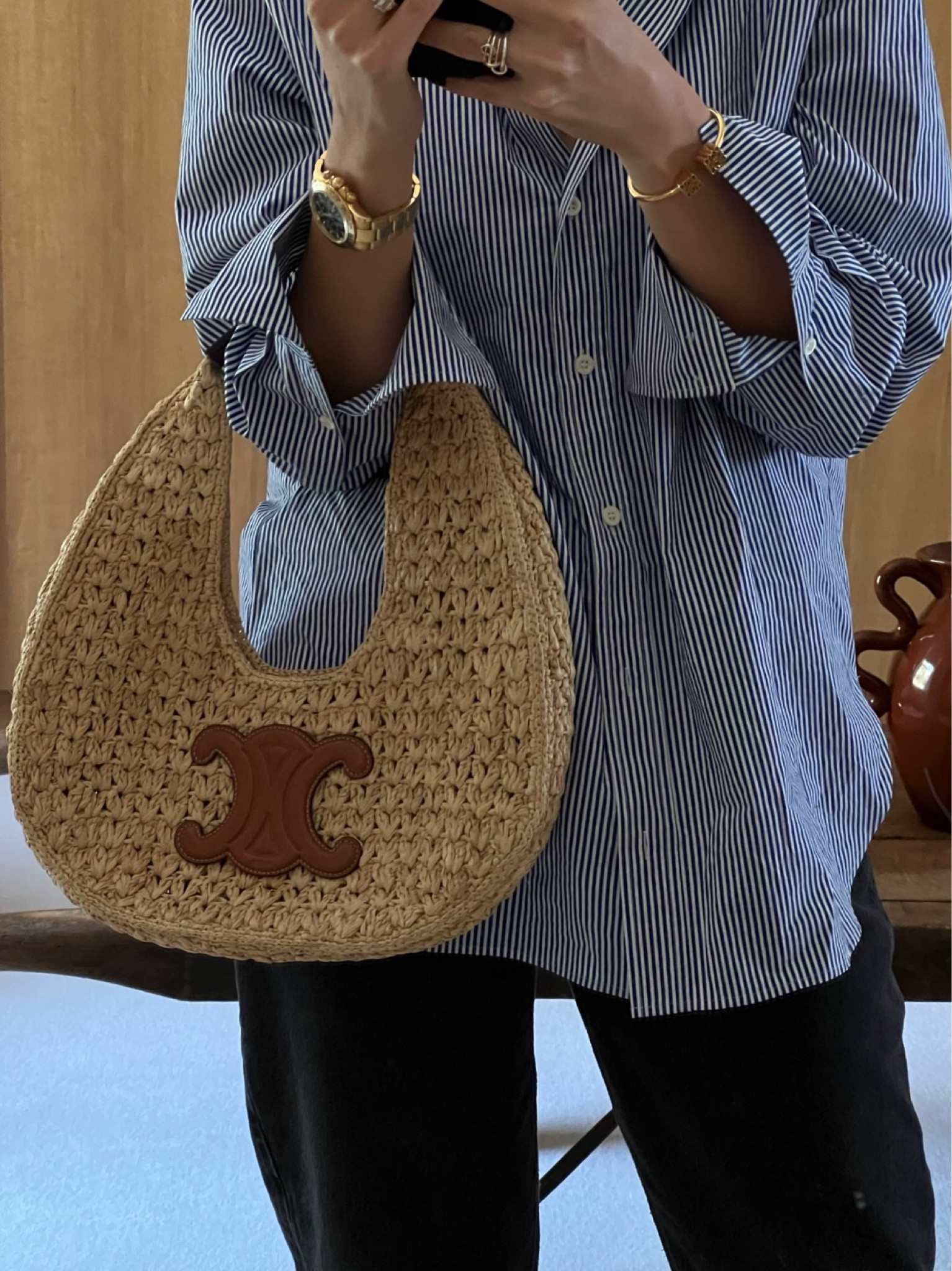 FRAME stripe shirt, LOEWE anagram bracelet, CELINE triomphe bag, basket bags, raffia bag, summer tote, stripe shirt blue and white stripes, sale item, relaxed style, gold bracelet, gold jewellery, 

#LTKstyletip #LTKeurope #LTKtravel