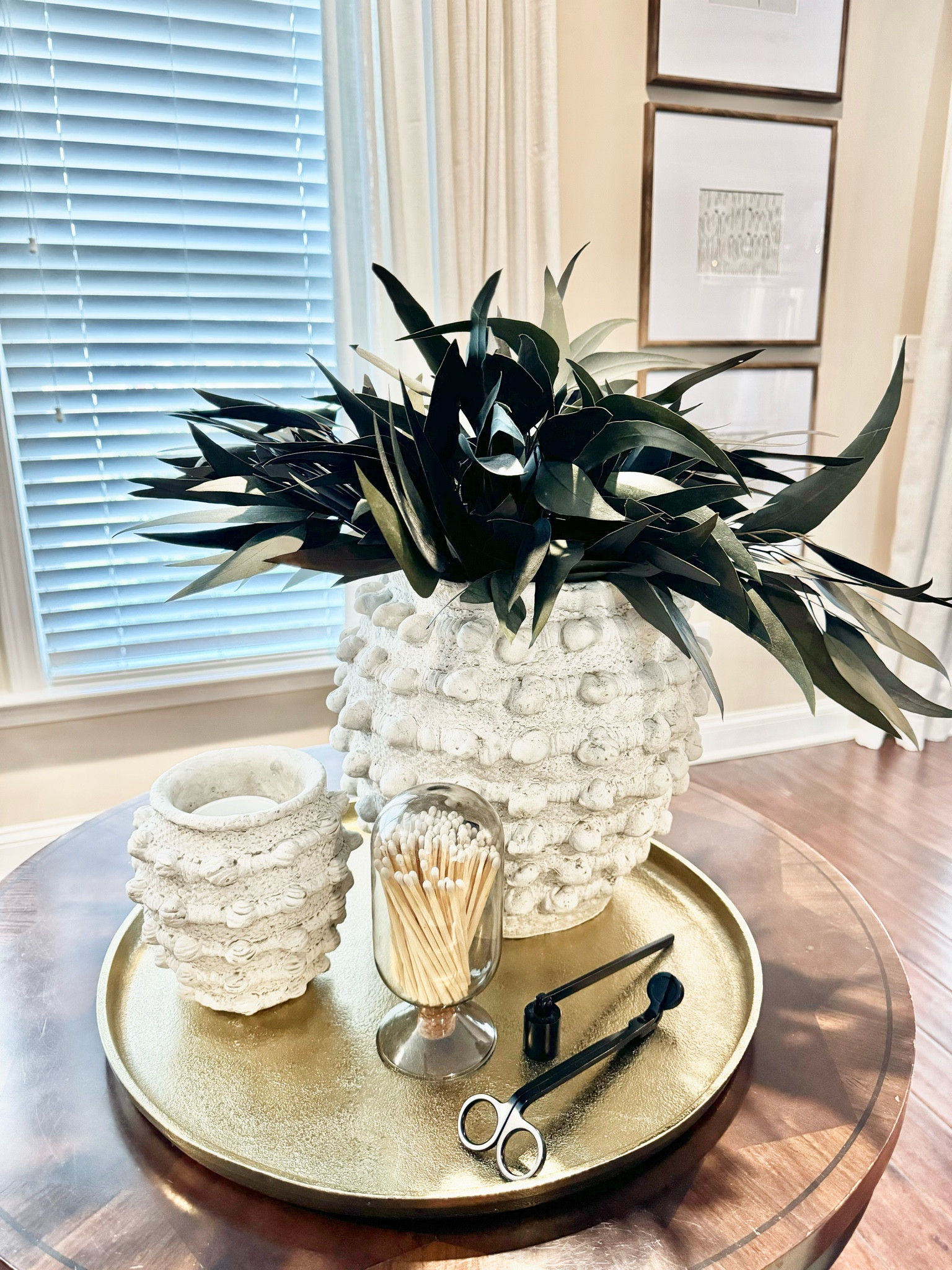 I really love these textured vases. My favorite way to set up a vignette is with decorative items of varying height, some greenery, and a candle  

#LTKHome