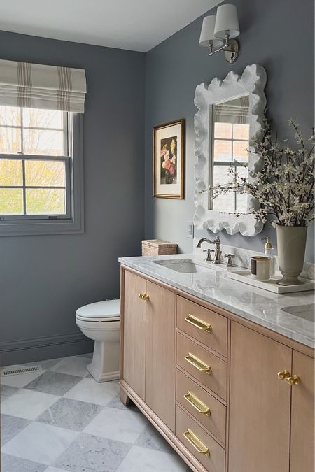 #ad This paint color I chose from HGTV Home by Sherwin Williams at @loweshomeimprovement was one of the most asked about elements of this bathroom design! It’s called “Let it Rain” and is such a pretty deep blue/gray tone. During Lowe's SpringFest sale Buy 2 Get 1 Free HGTV Home® by Sherwin-Williams paints and primers and Cabot® stains via Lowe’s gift card rebate 4/18 - 5/1. I always use Sherwin Williams paint because it covers so well—as you can see I didn’t have to prime, and did one coat in the room! I used satin on the walls, and semi gloss on the trim. #lowespartner I’m going to link the paint along with all of my go-to paint tools from Lowe’s that made this job quick and easy!

#LTKhome #LTKstyletip #LTKsalealert